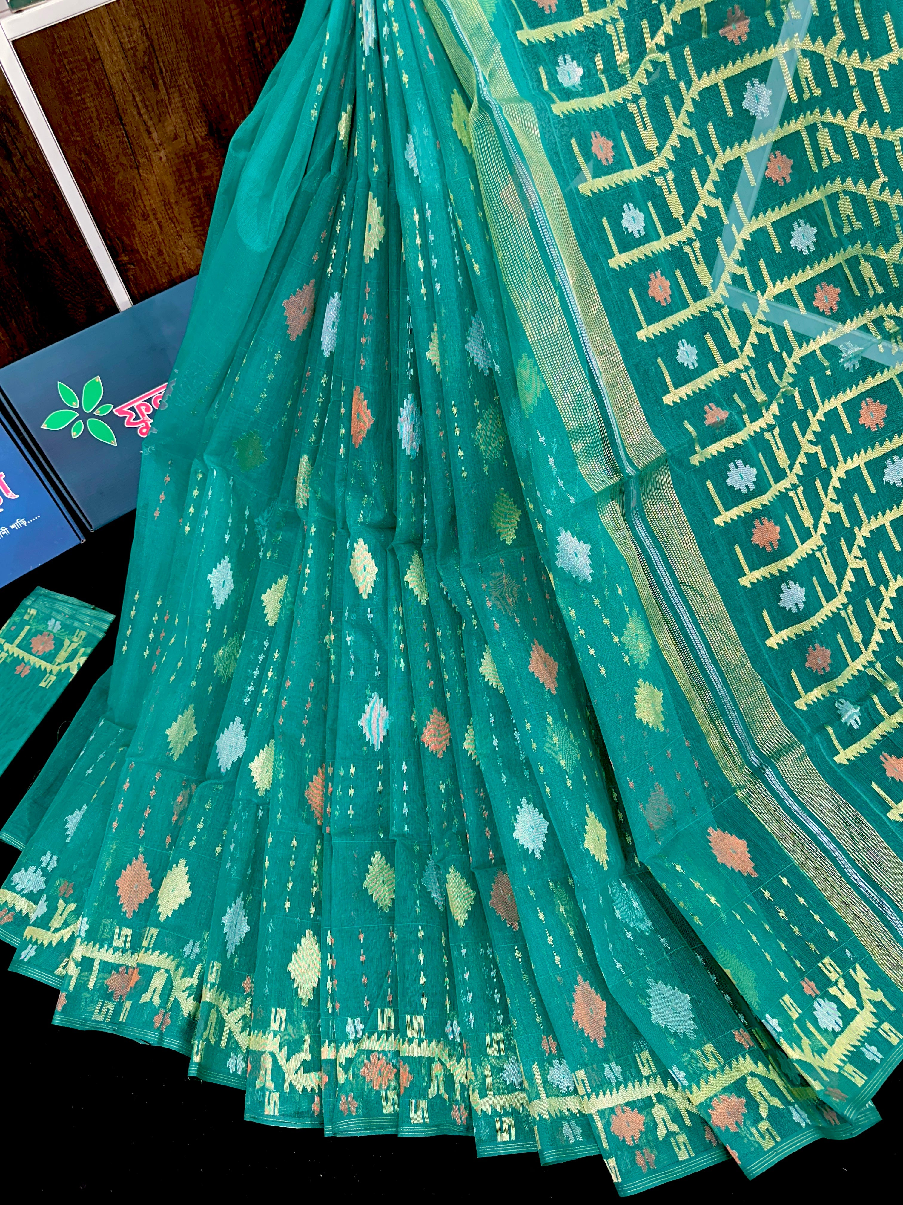Sea green halfsilk jamdani saree with golden silver & copper jori work.