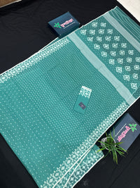 Mint cotton jamdani saree with white threads work all over work and blouse piece.
