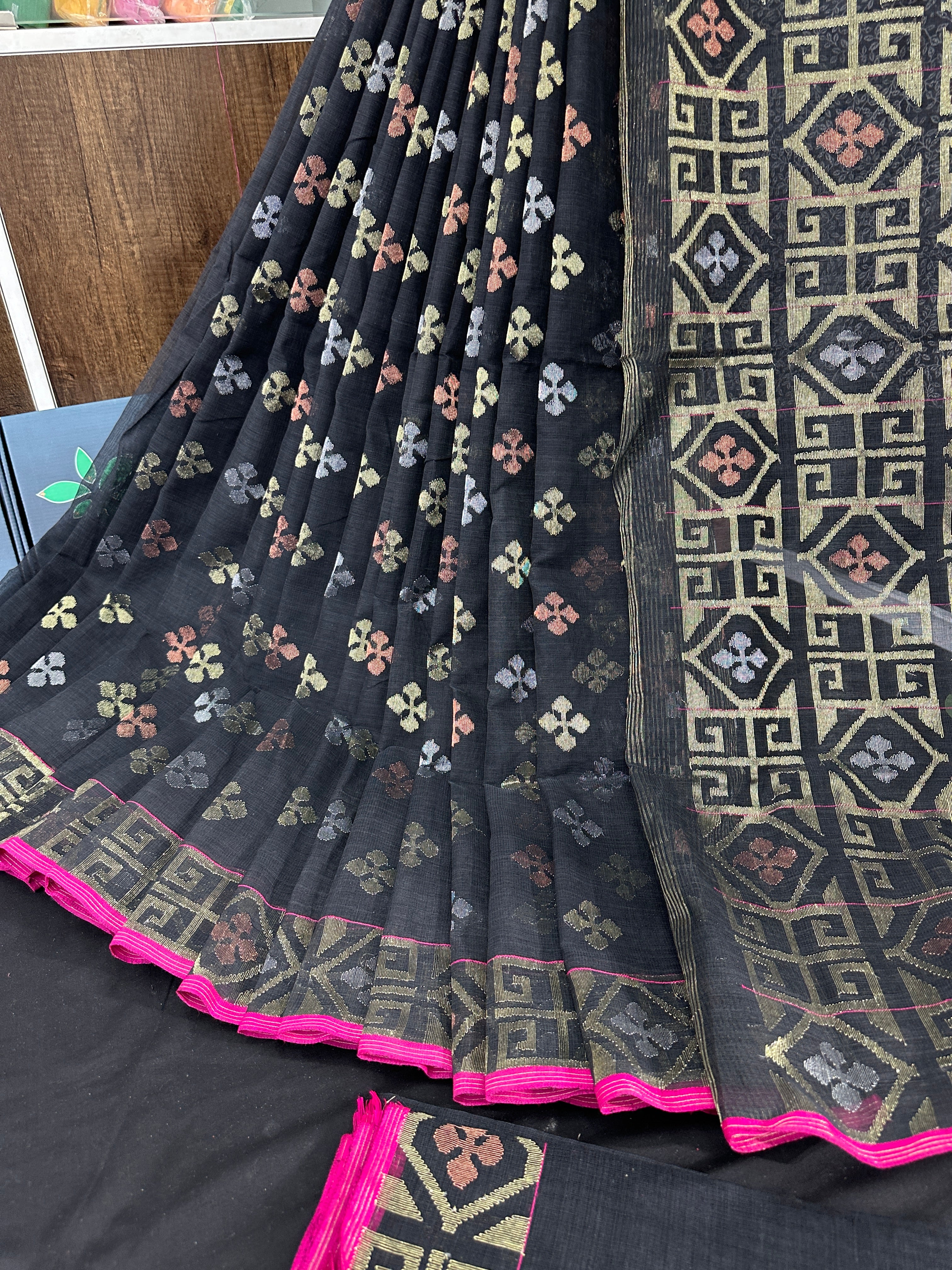 Black jamdani saree with golden silver and copper jori work and pink border
