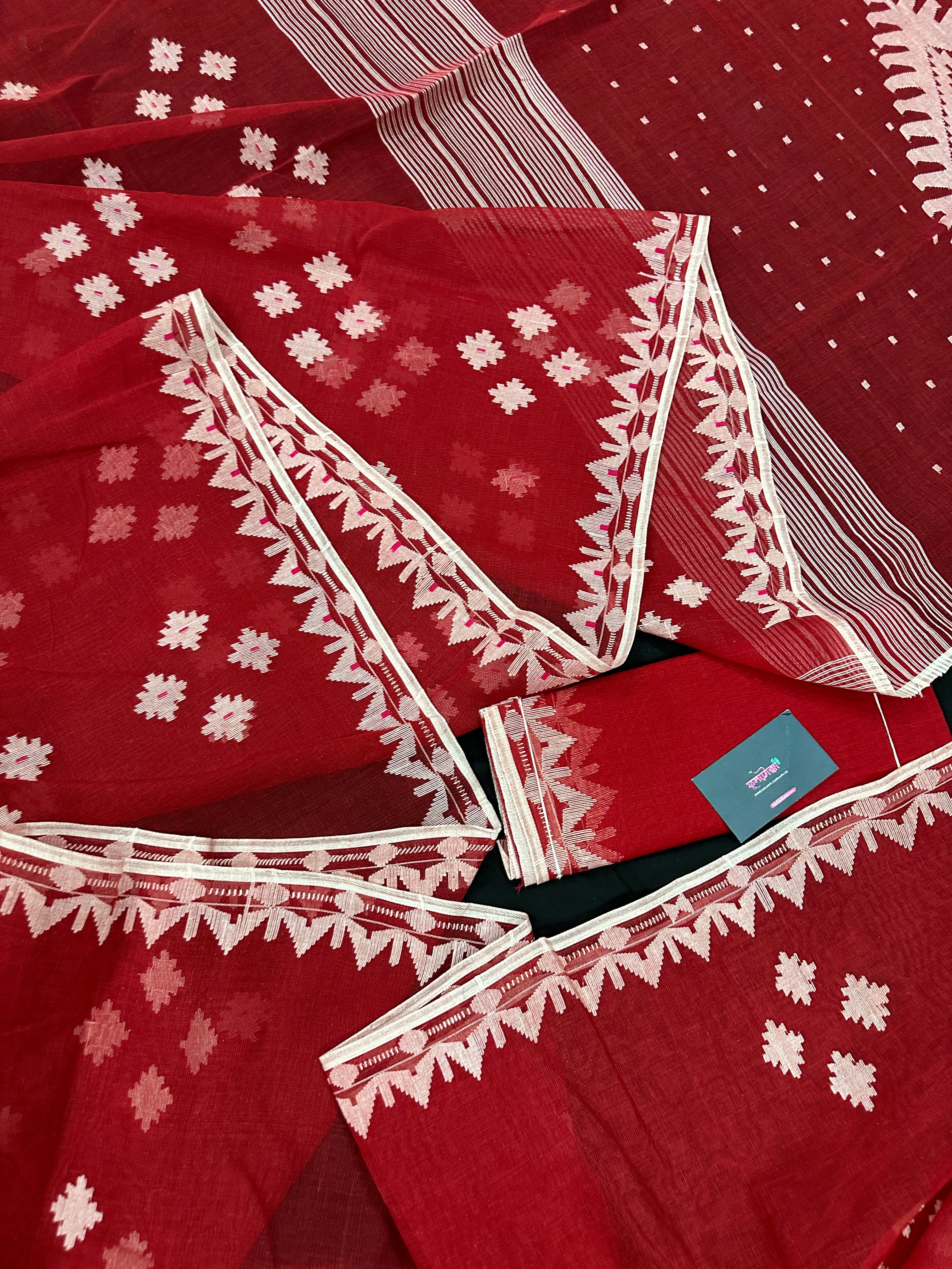Radish Maroon cotton jamdani saree with white threads work all over work.