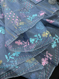 Powdery blue jamdani saree with pink blue and golden jori work.