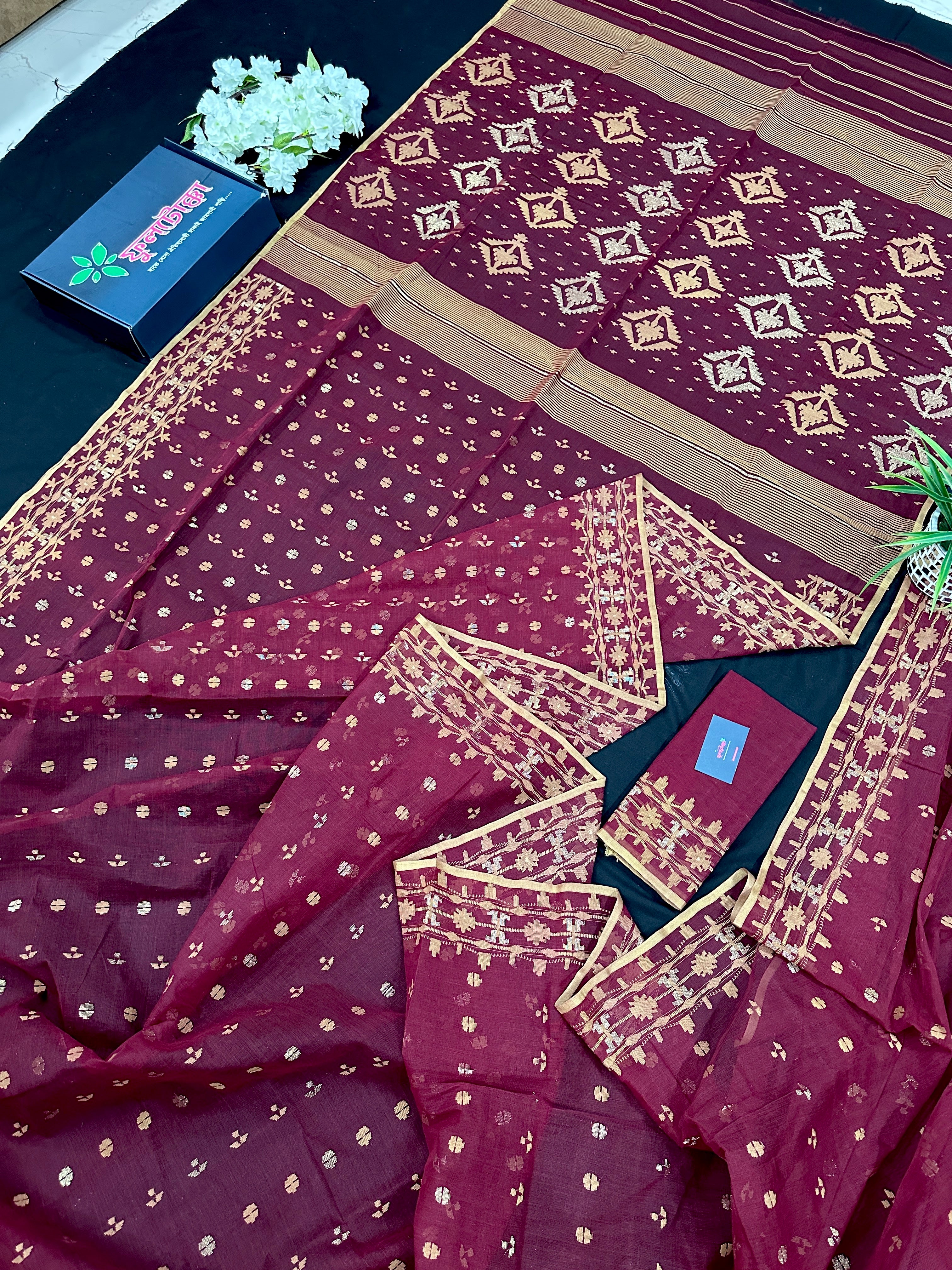 Maroon cotton jamdani with yellowish threads work.