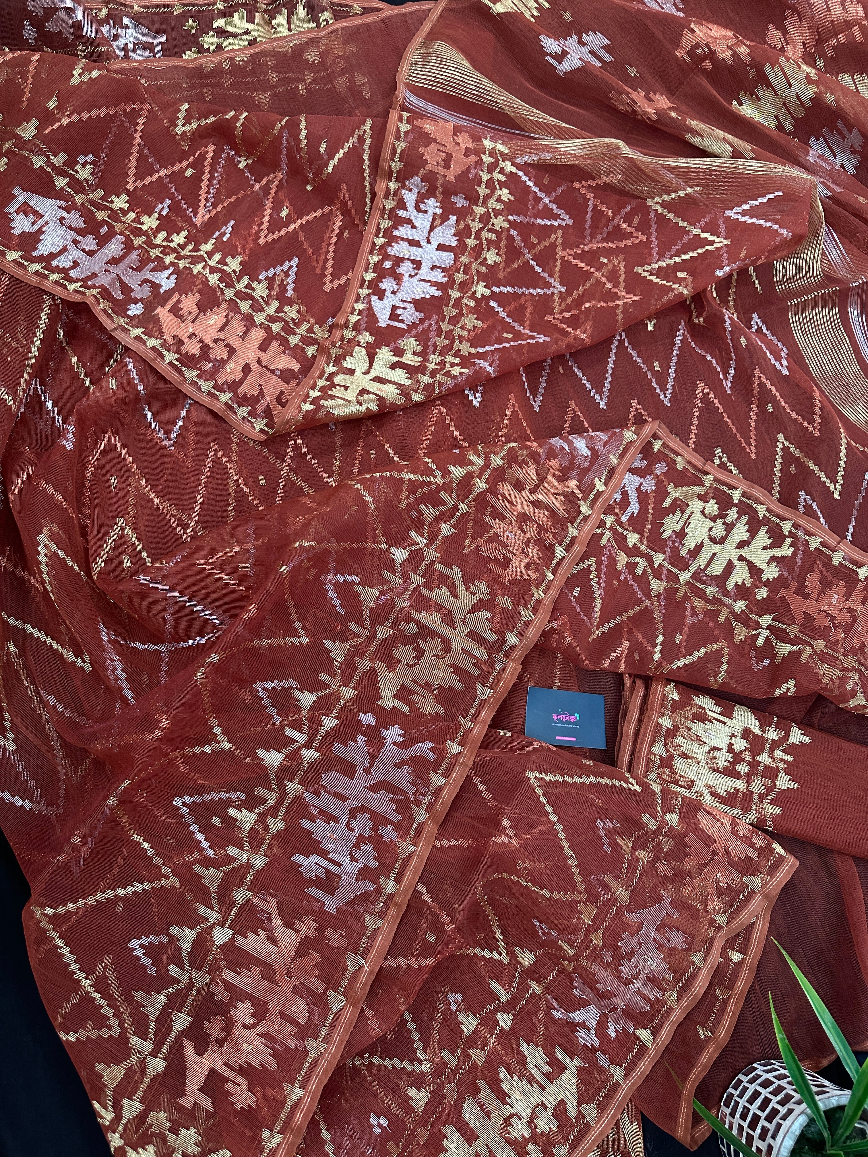 Brown reshom halfsilk jamdani saree with golden silver & copper jori work.
