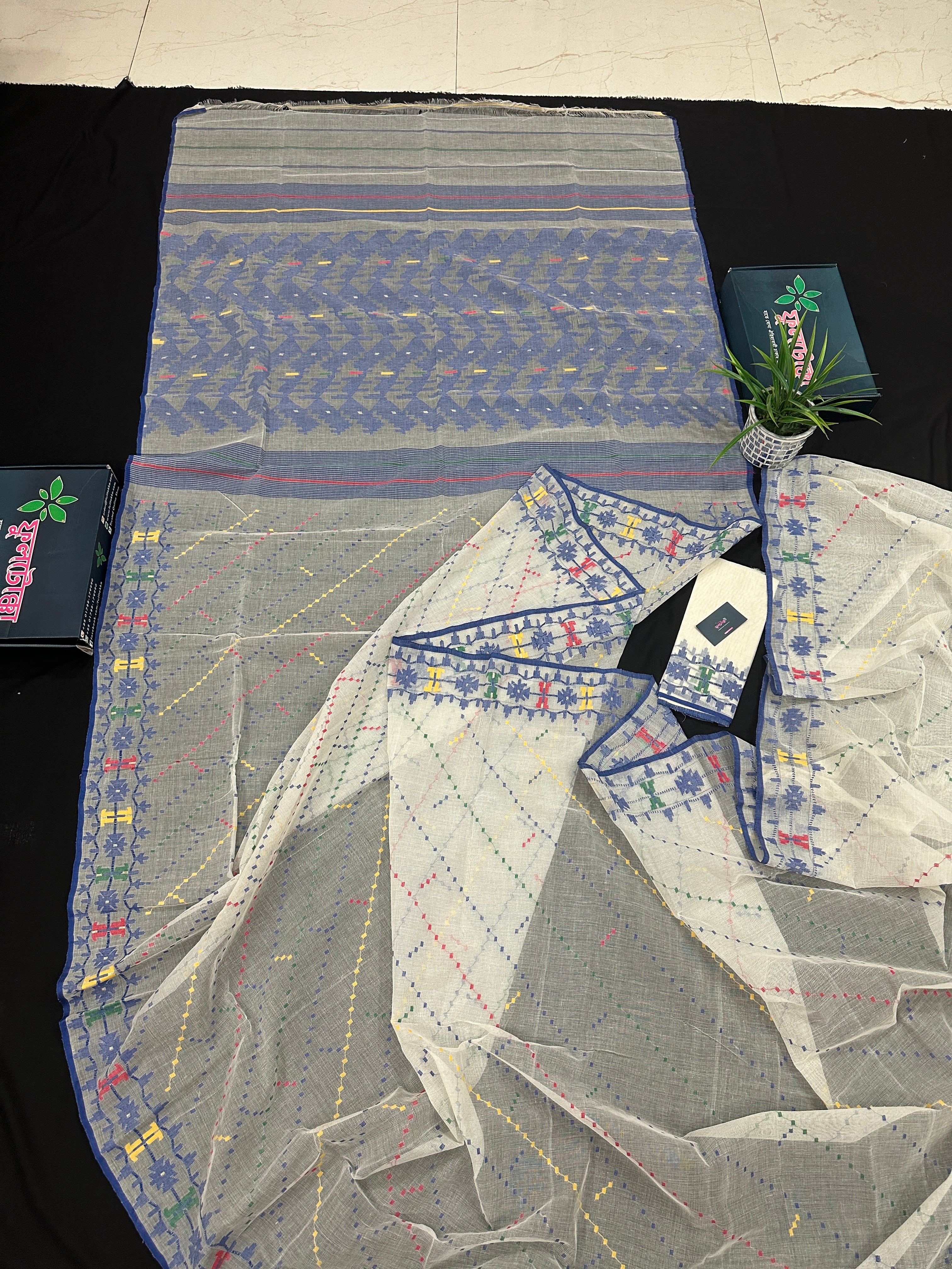 White cotton jamdani saree with blue yellow red green threads work& blouse piece.