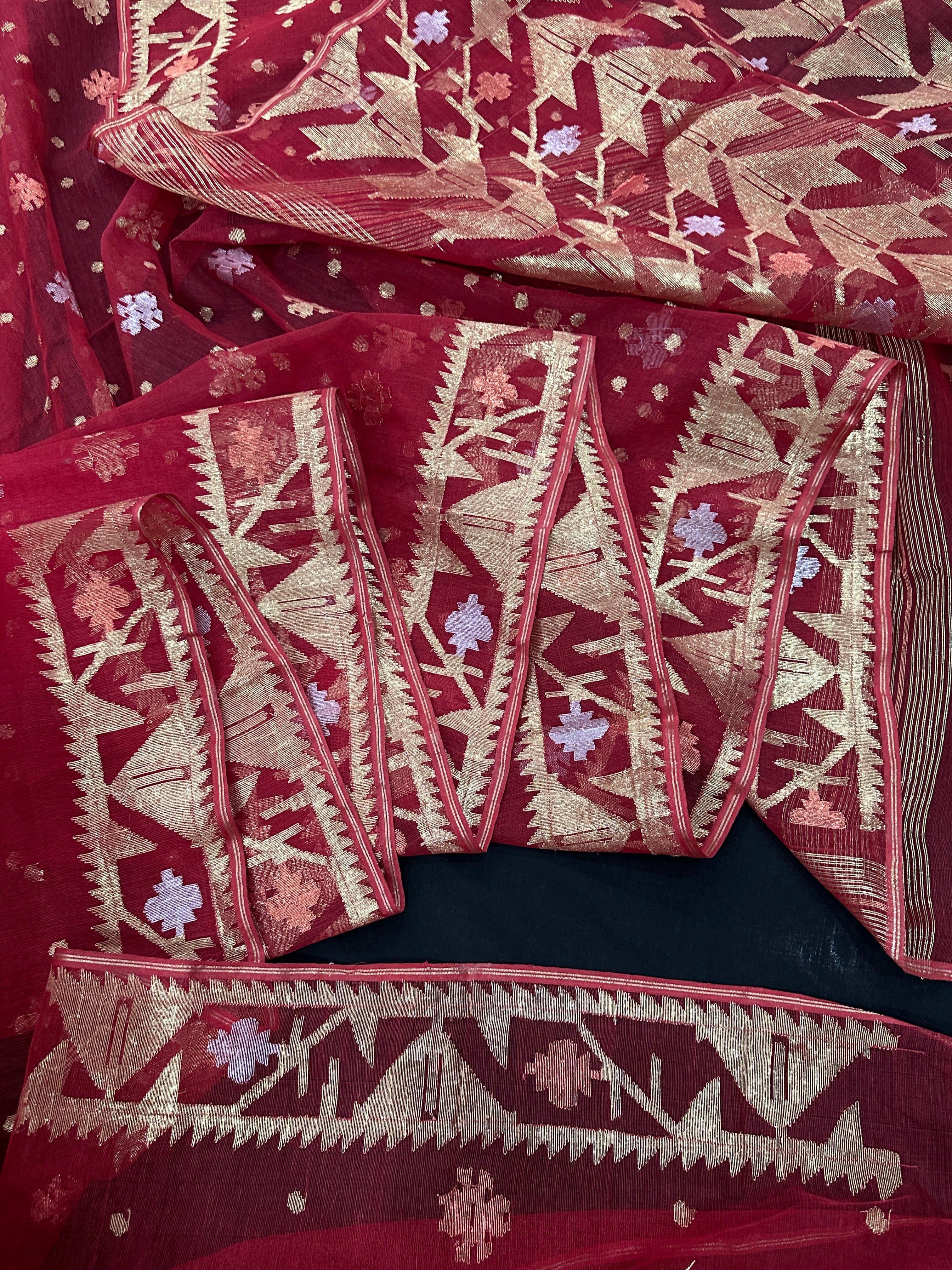 Red jamdani saree with golden jori all over work with blouse piece.