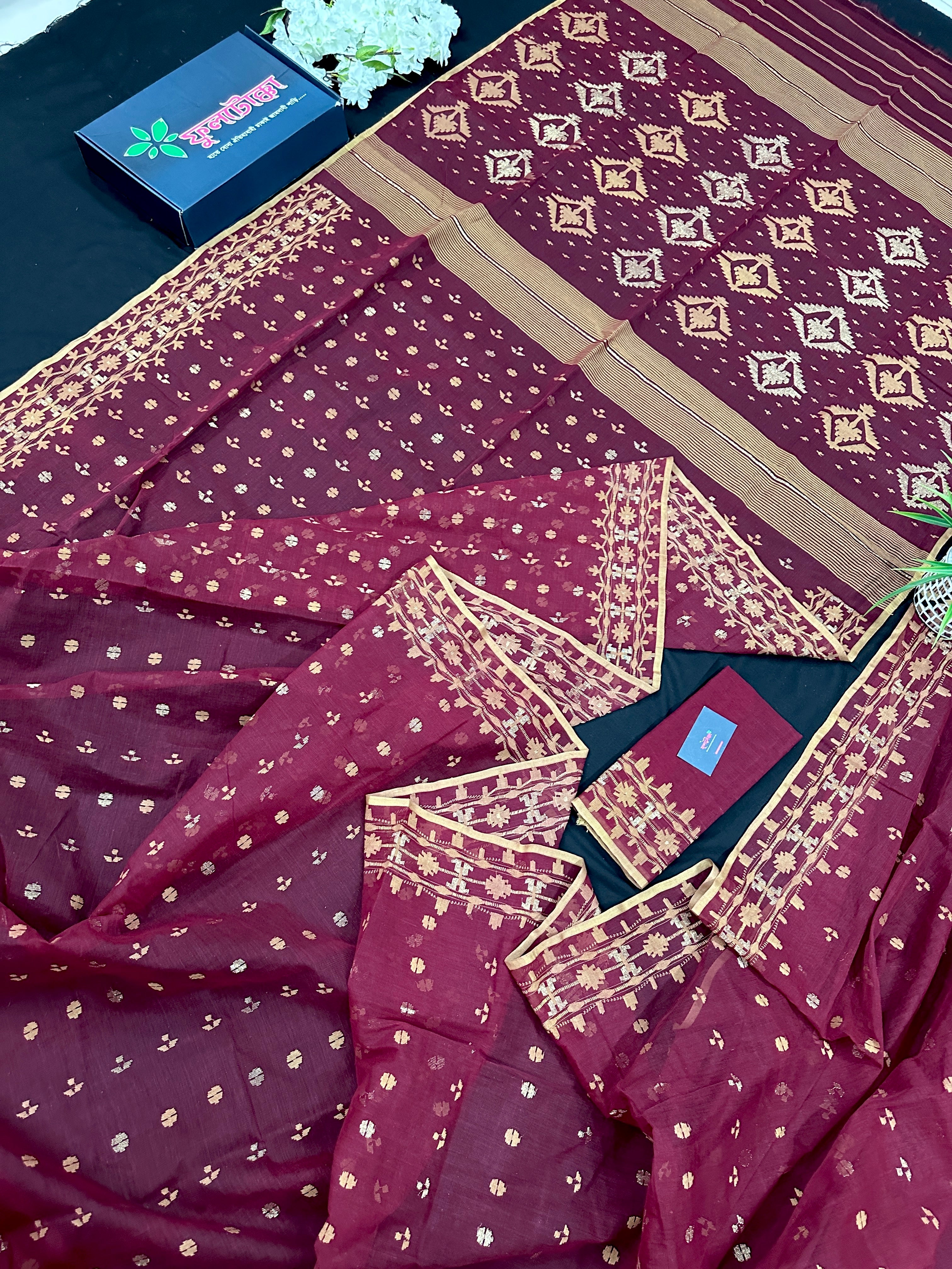 Maroon cotton jamdani with yellowish threads work.