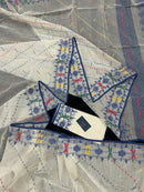 White cotton jamdani saree with blue yellow red green threads work& blouse piece.