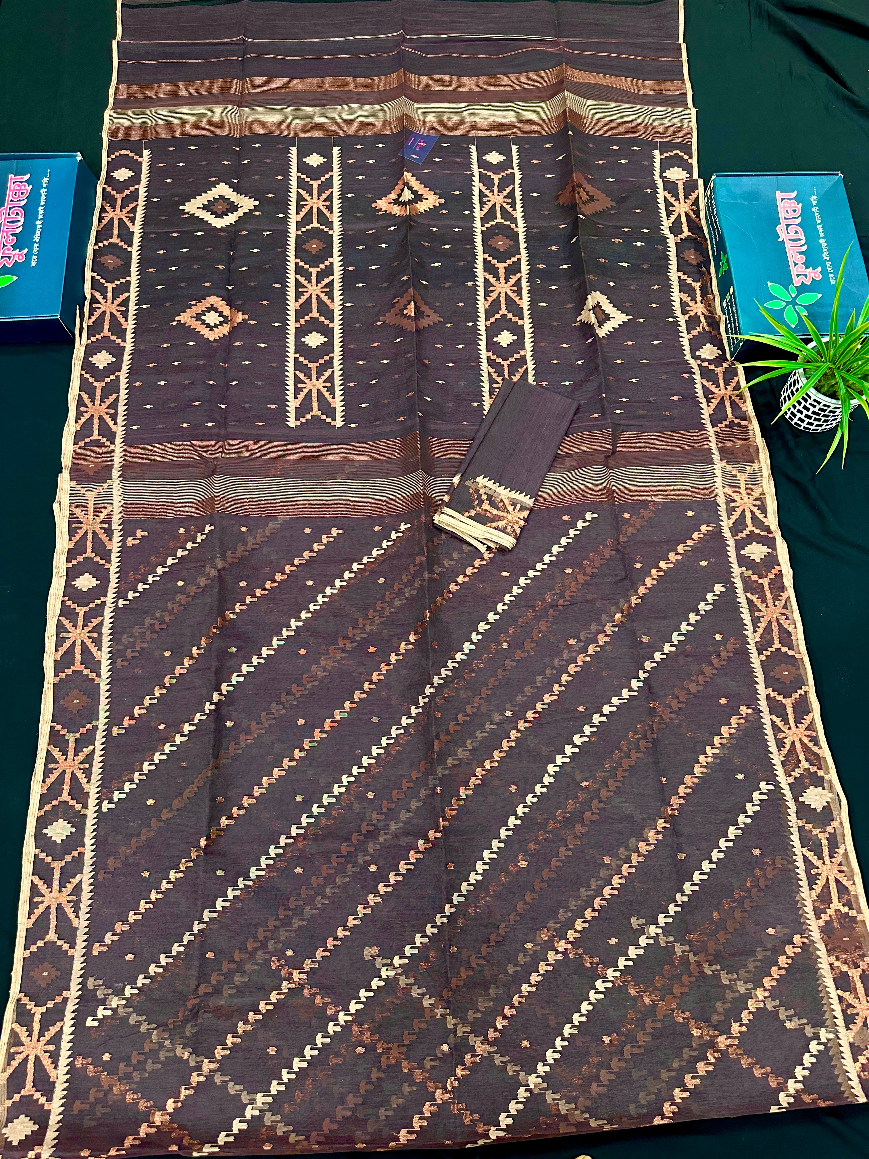 Brown colour jamdani saree with brown & off white threads work.