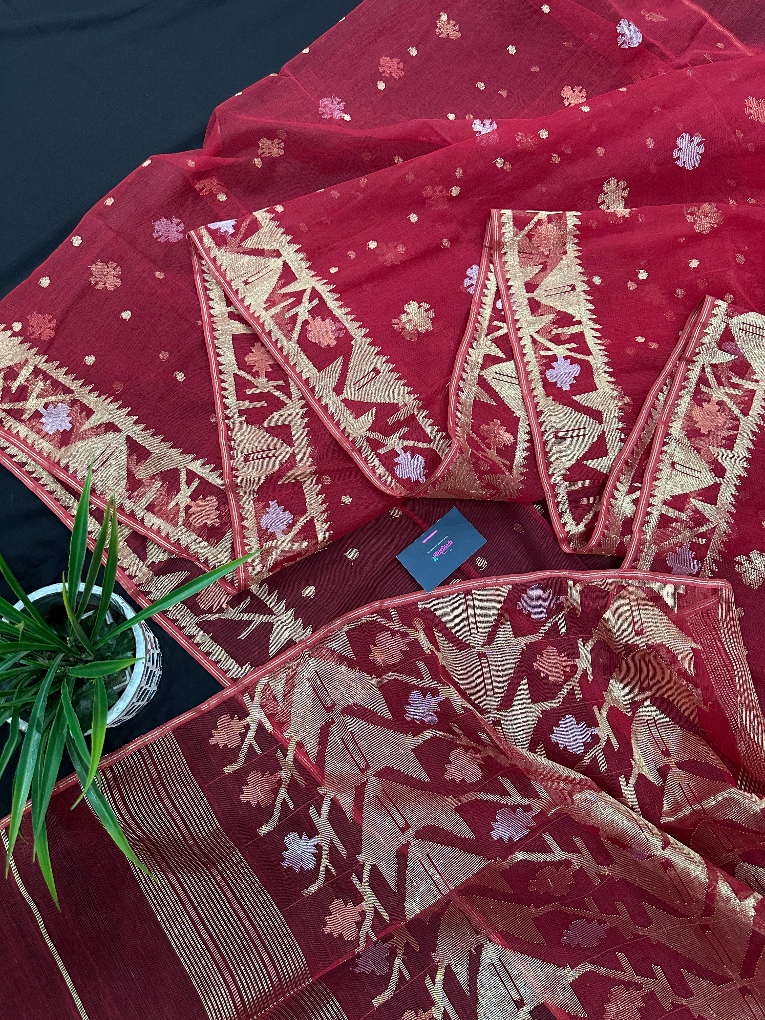 Red jamdani saree with golden jori all over work with blouse piece.