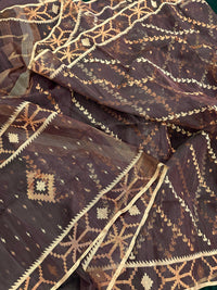 Brown colour jamdani saree with brown & off white threads work.