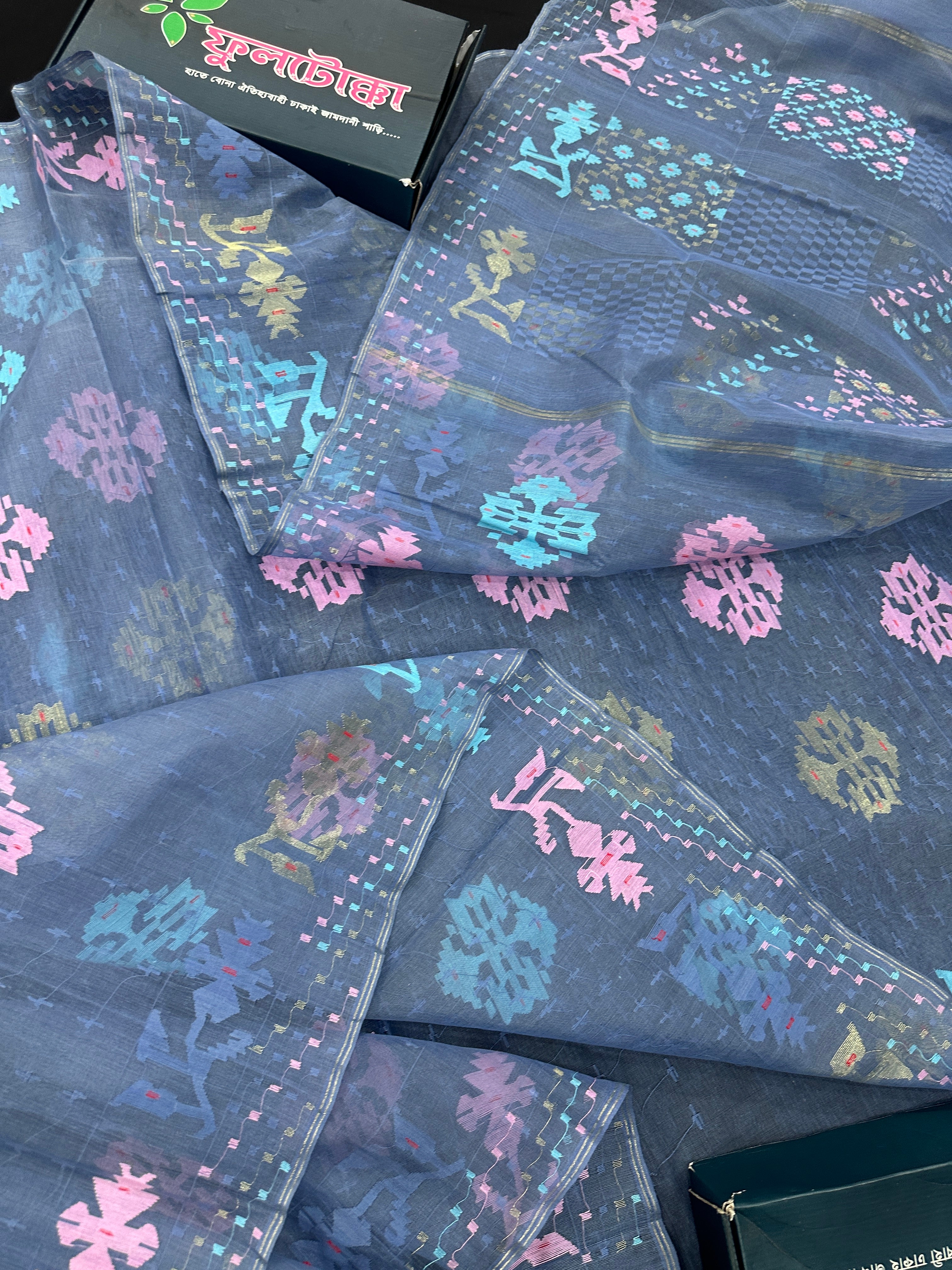 Powdery blue jamdani saree with pink blue and golden jori work.