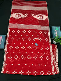 Radish Maroon cotton jamdani saree with white threads work all over work.