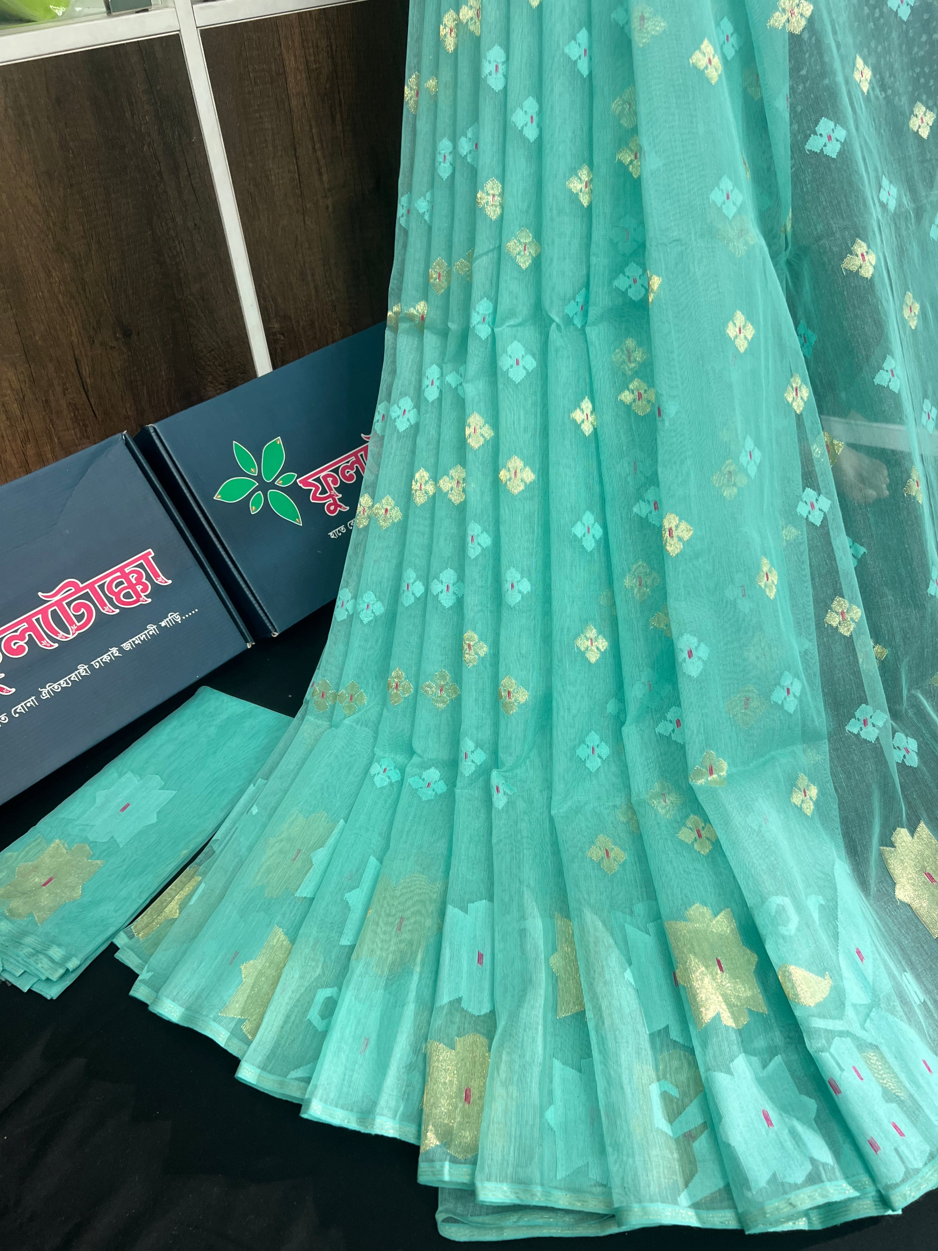 Sky blue halfsilk jamdani saree with golden jori work and self threads work