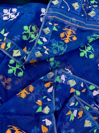 Royal blue jamdani saree with green pink blue orange threads work.