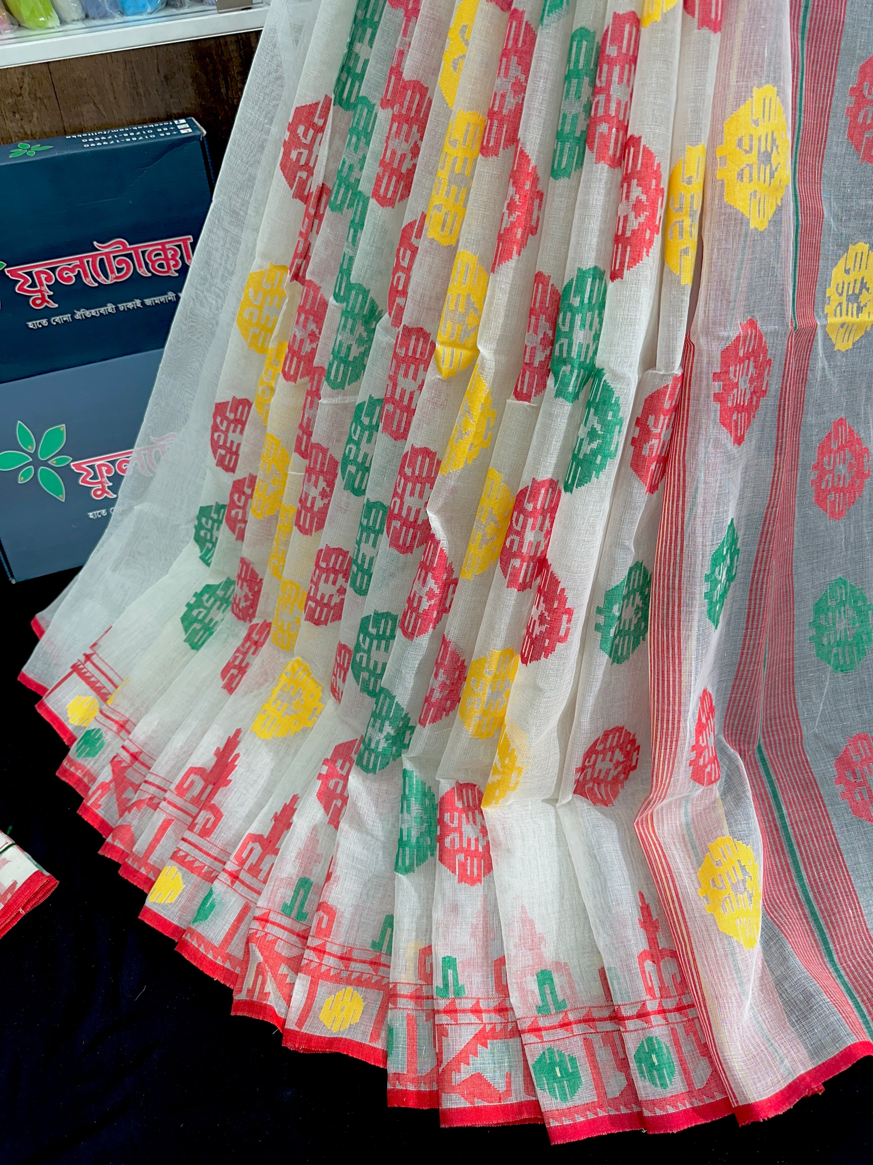 White cotton jamdani saree with red yellow green threads work multiple colour threads work
