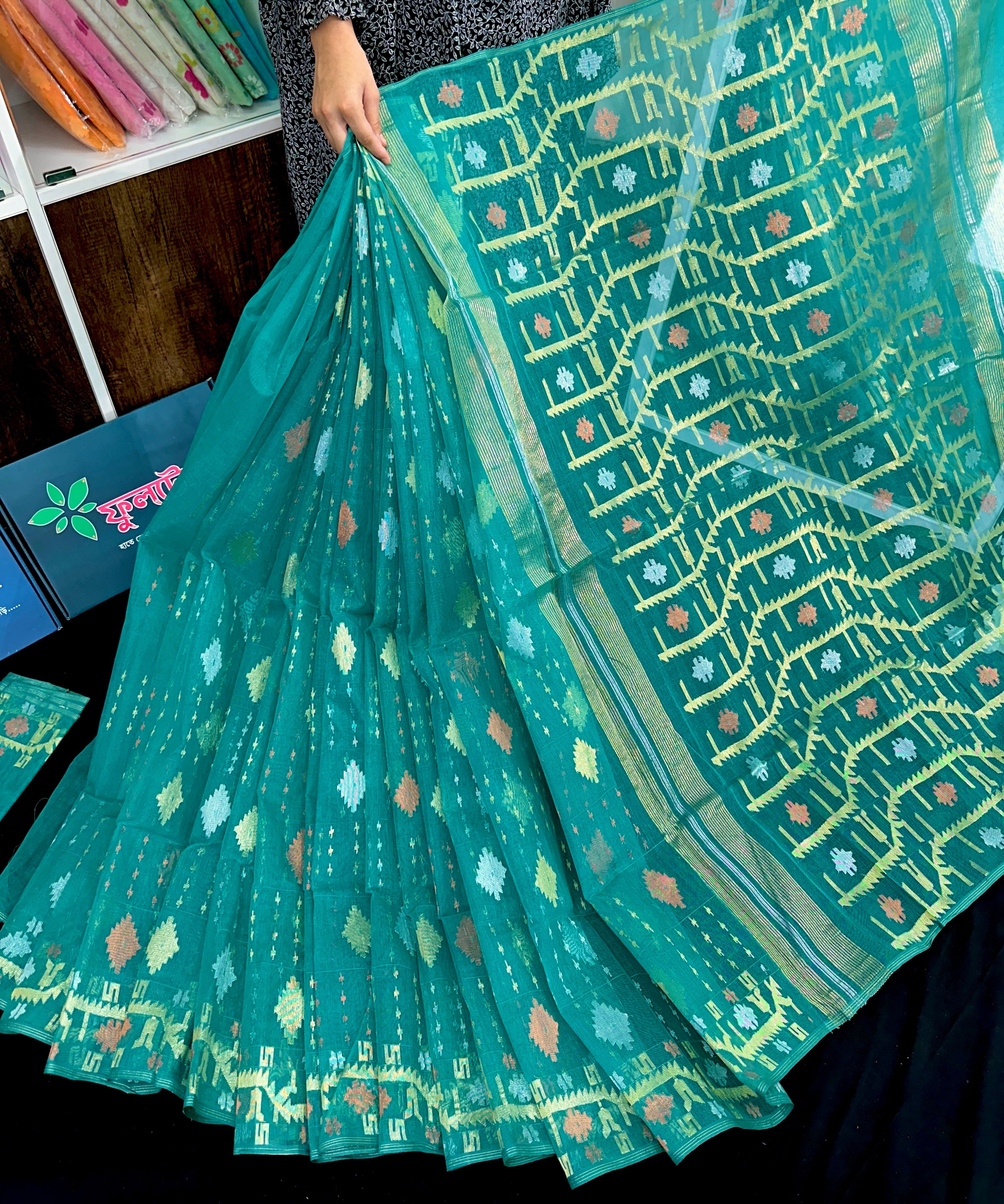 Sea green halfsilk jamdani saree with golden silver & copper jori work.