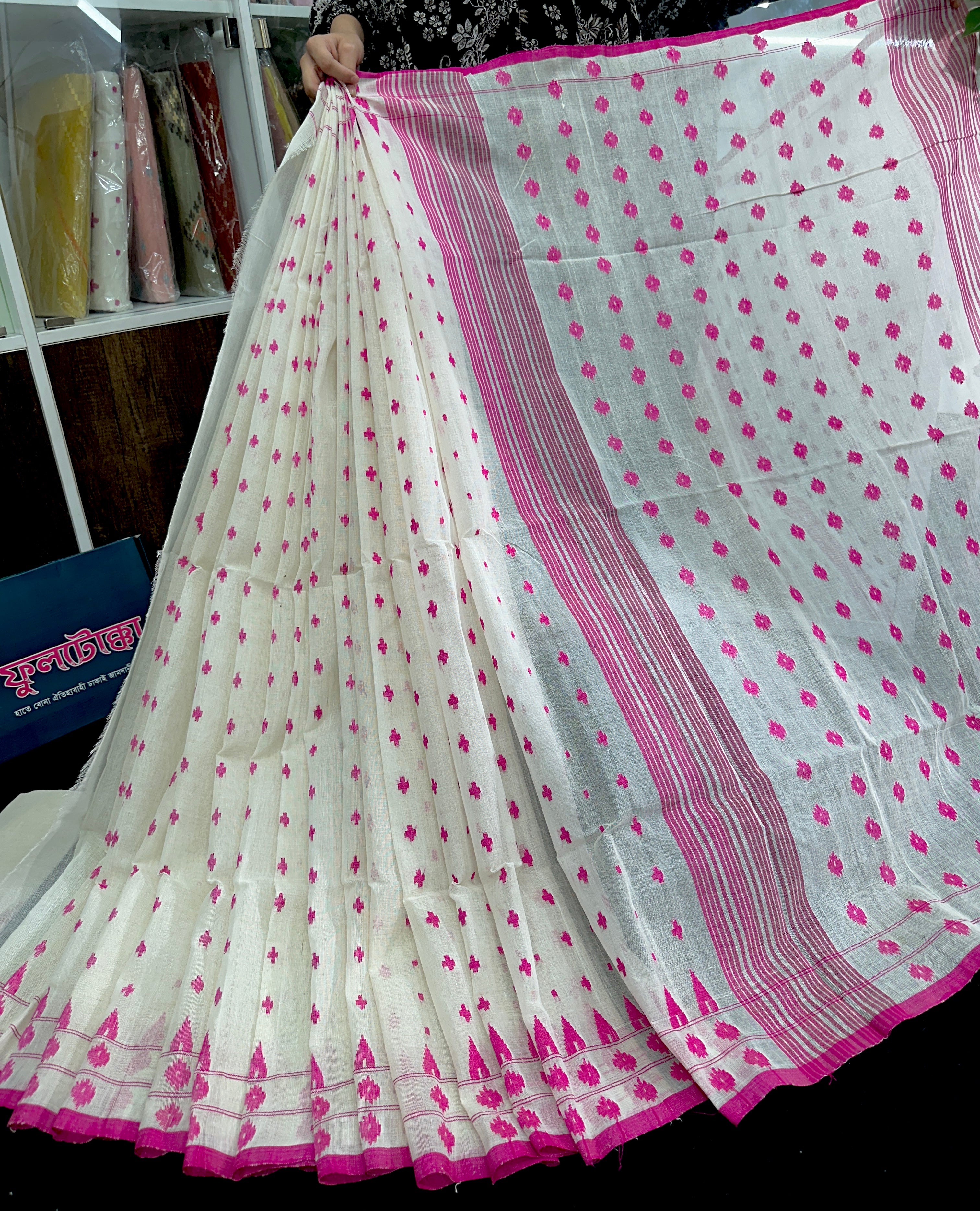 White cotton jamdani saree with pink buta and pink threads work