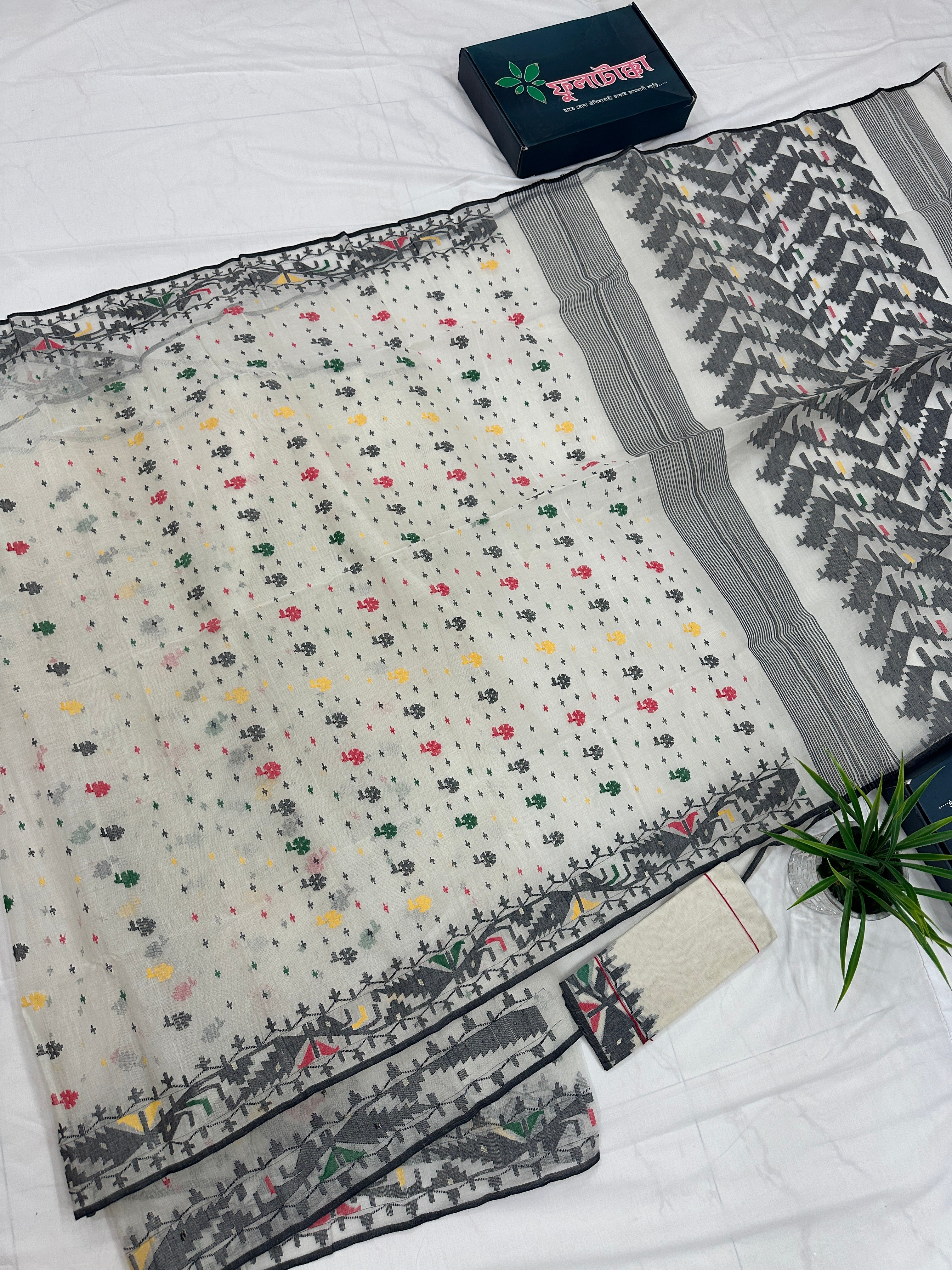 White cotton jamdani saree with black red yellow green threads work & blouse piece.