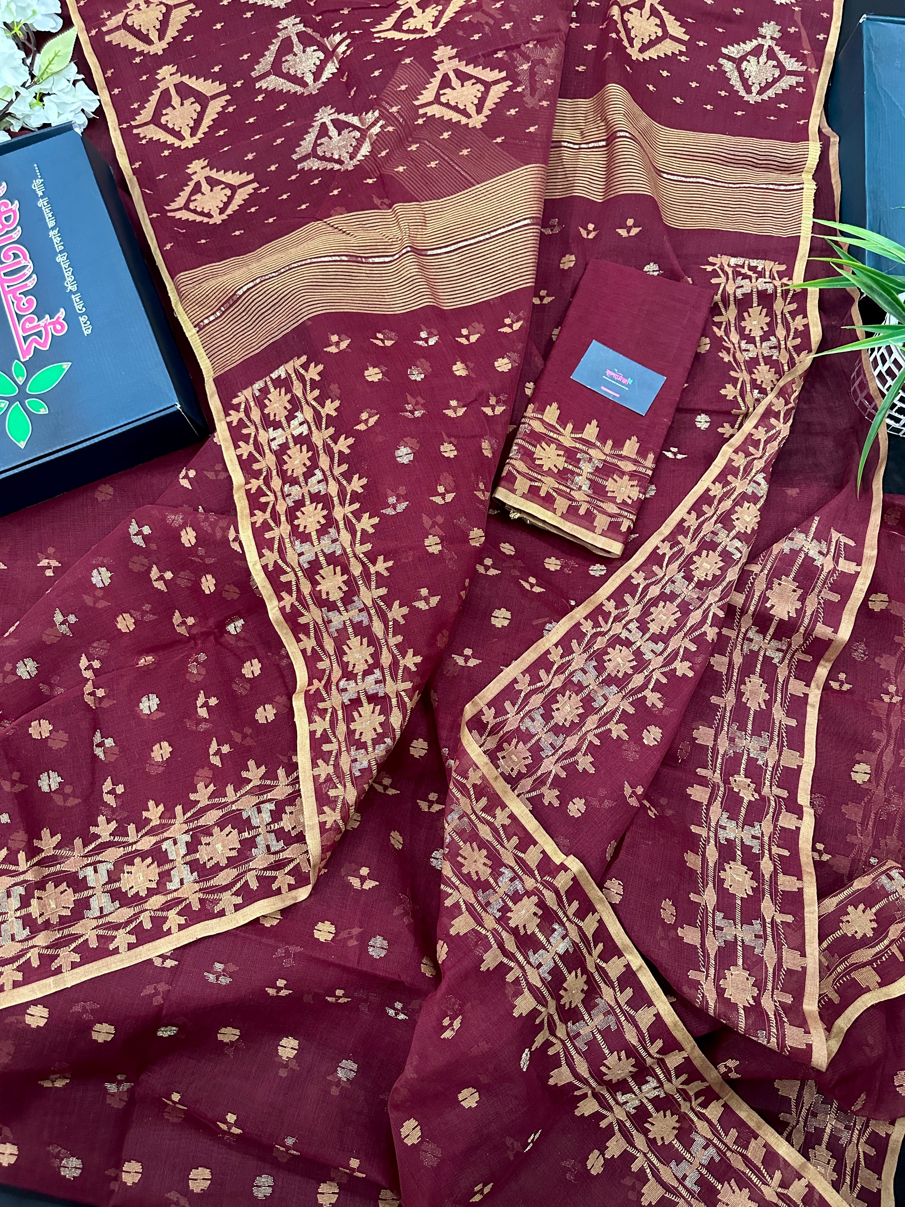 Maroon cotton jamdani with yellowish threads work.