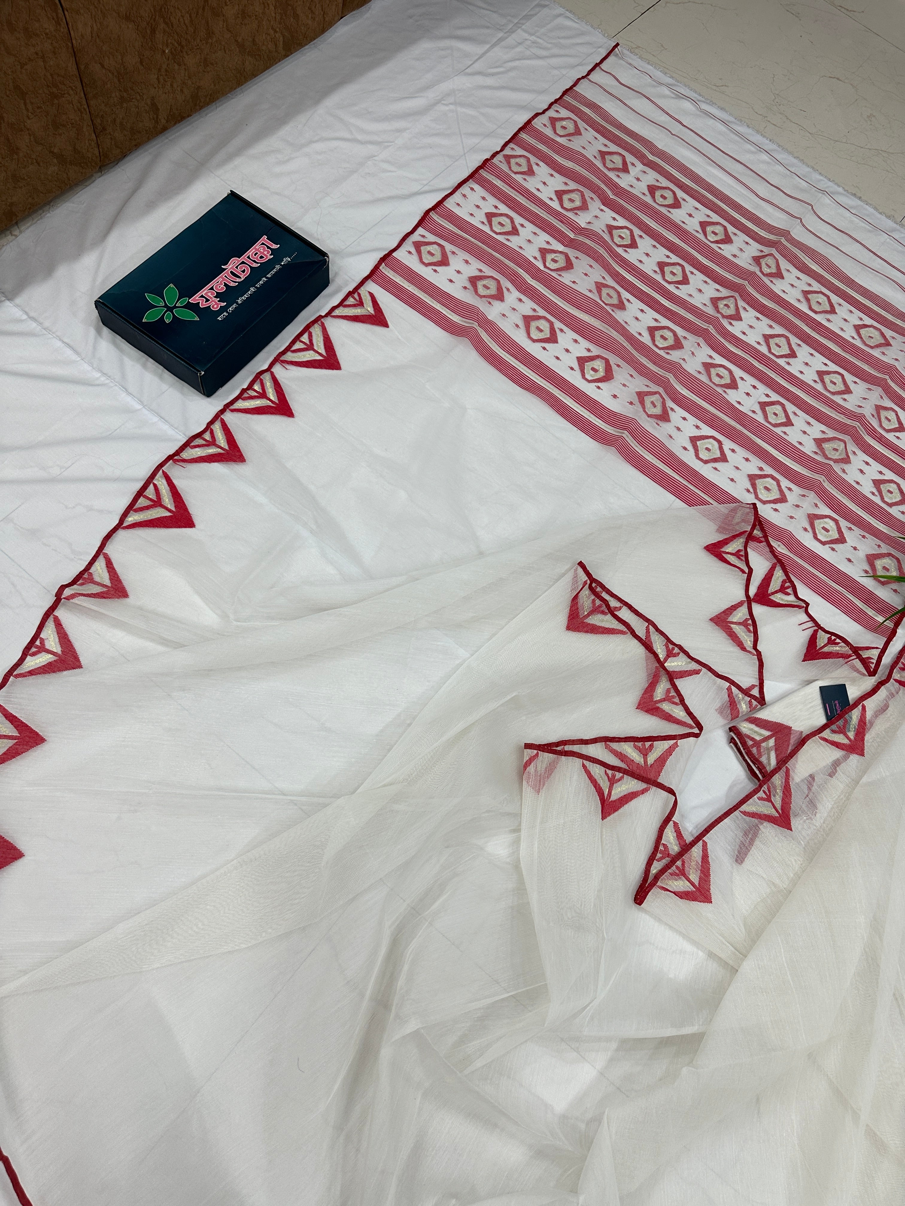 White Jamdani Saree With Red Paar.