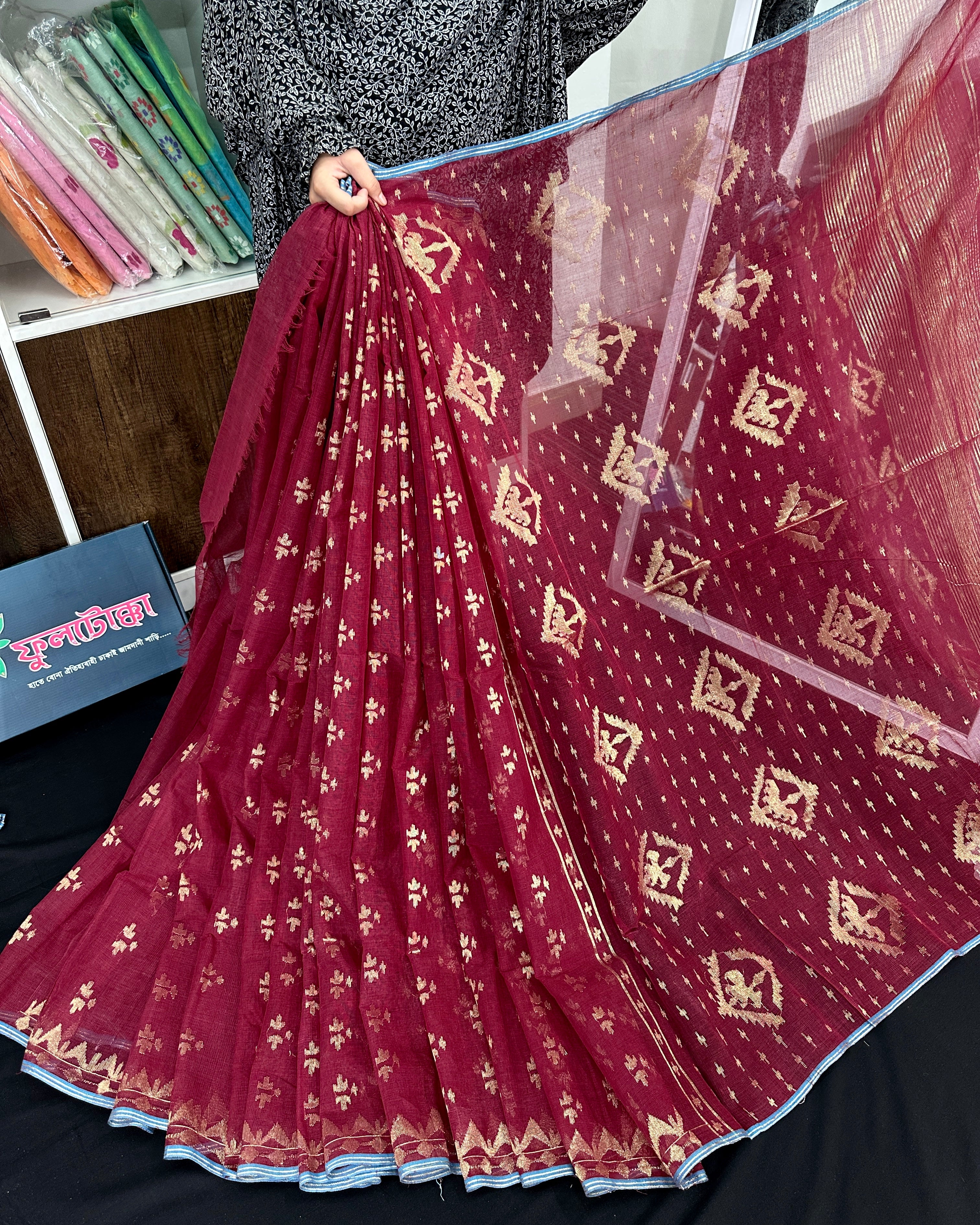 Maroon cotton jamdani saree with golden jori work and blouse piece.
