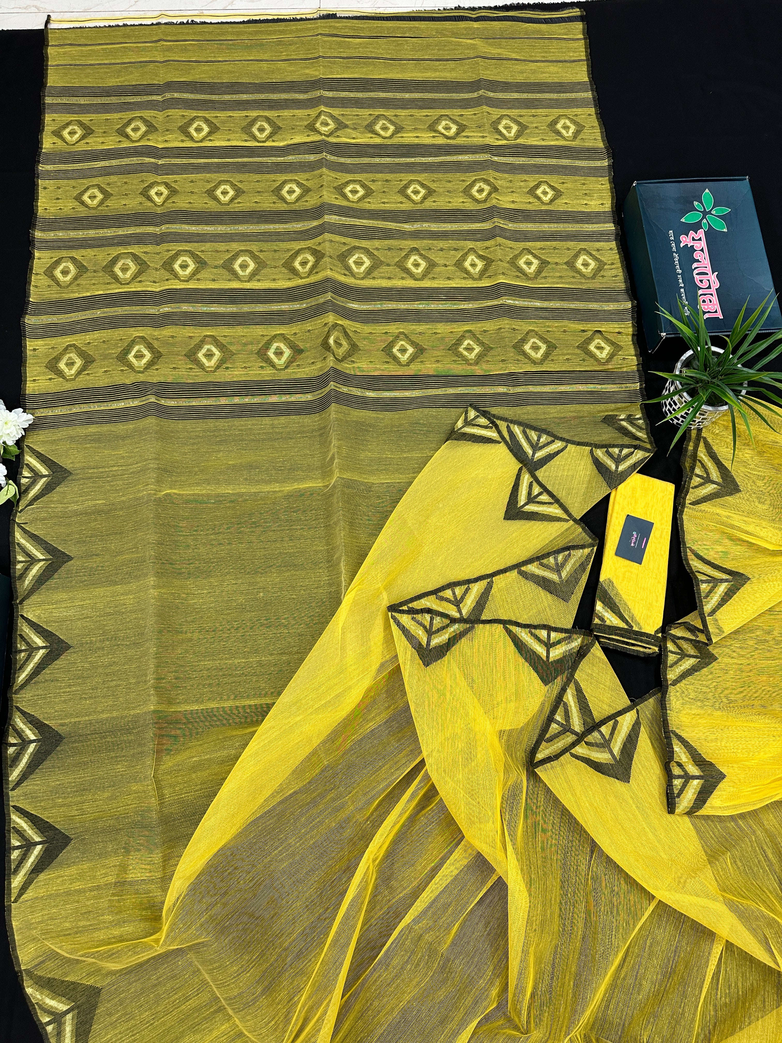 Yellow cotton jamdani sari with simple paar.
