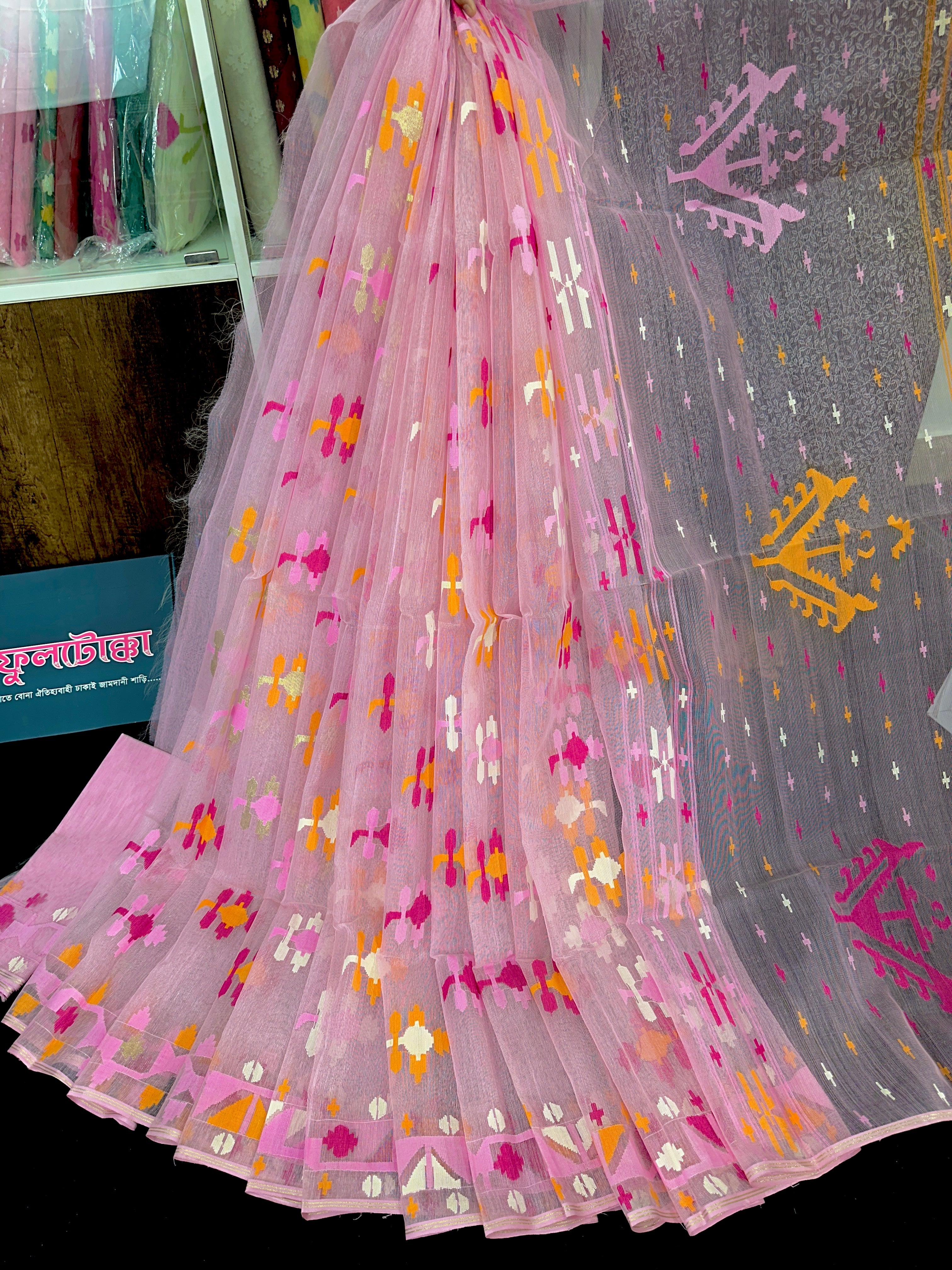 Baby pink halfsilk jamdani saree with white orange pink threads work