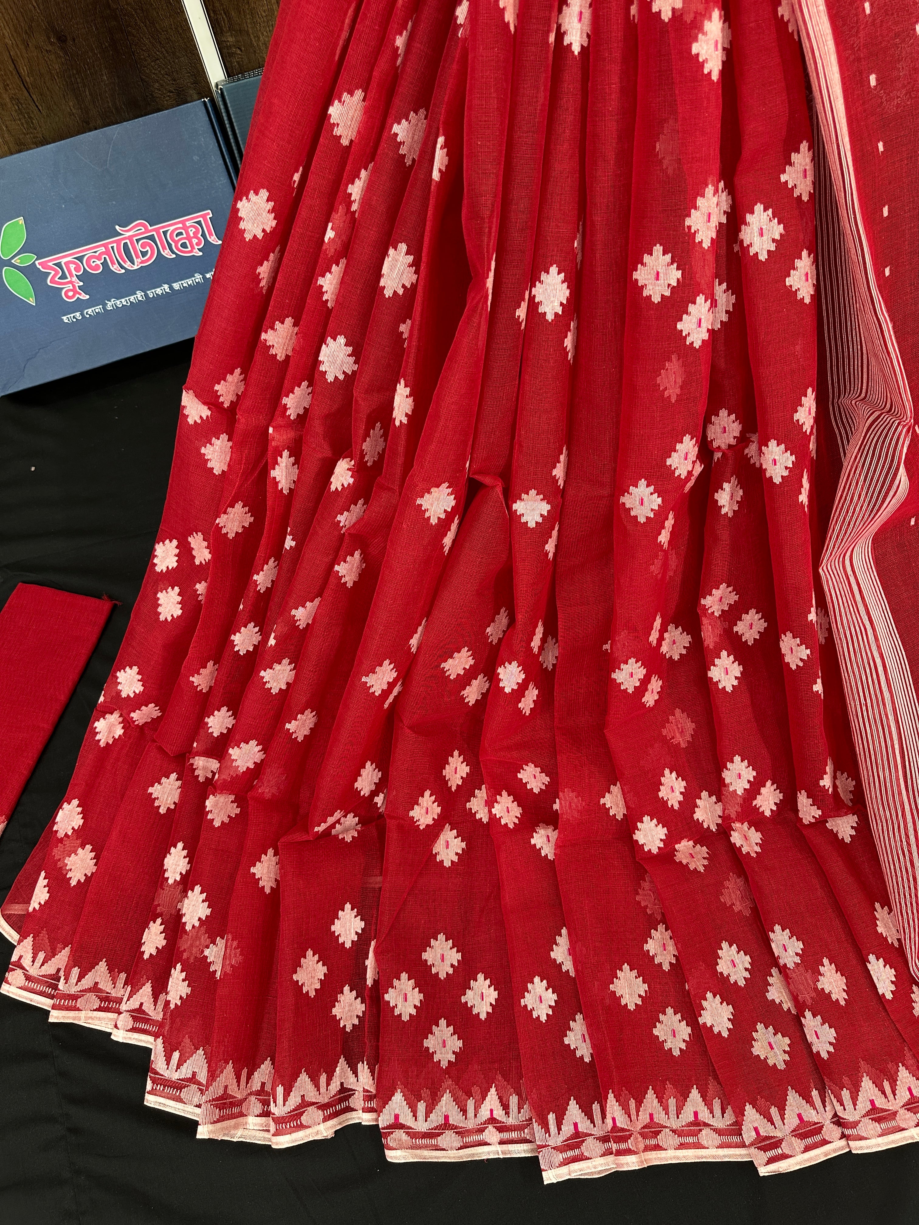 Radish Maroon cotton jamdani saree with white threads work all over work.