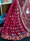 Maroon jamdani saree with golden jori work all over work with blouse piece.