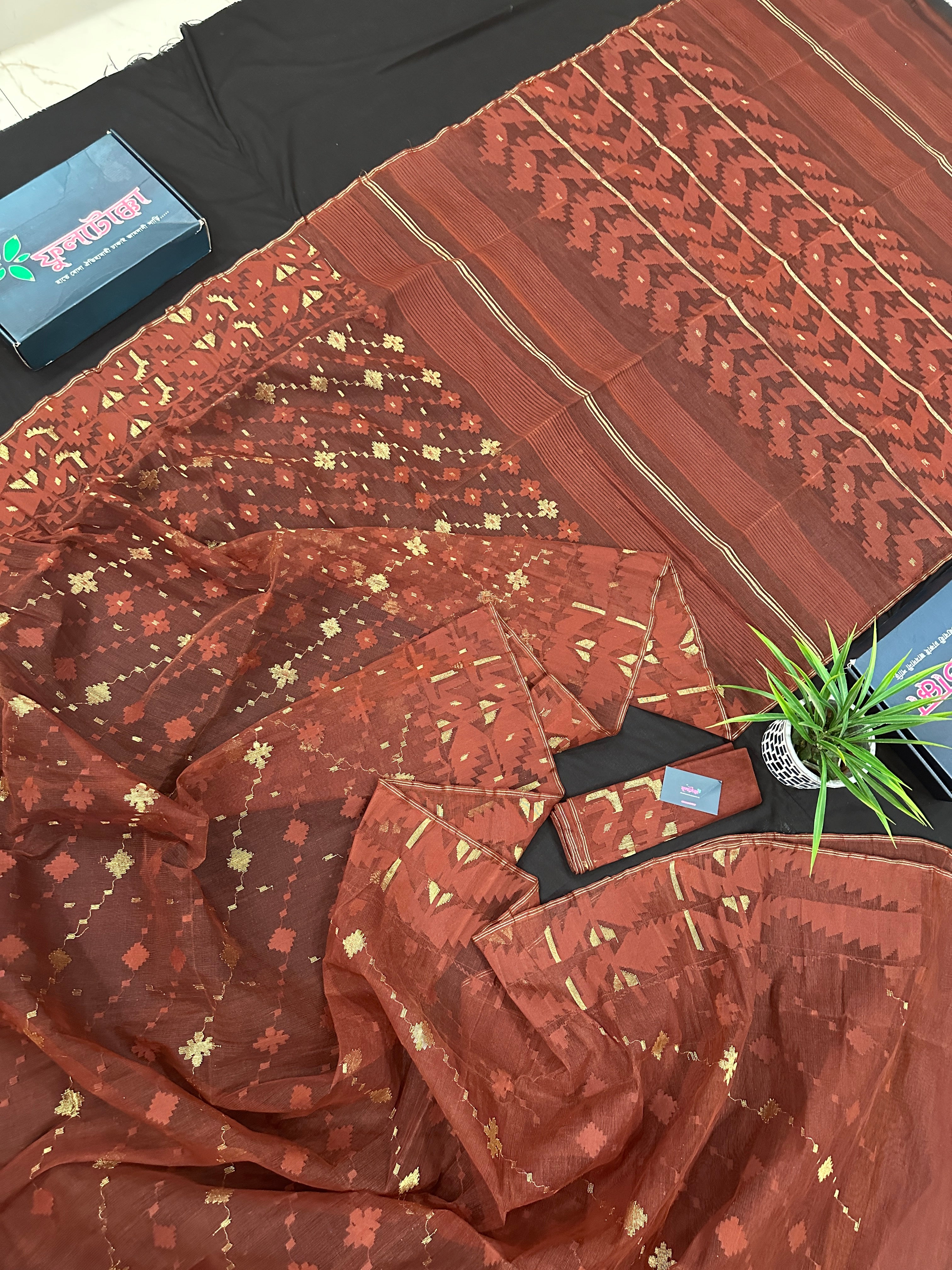 Mehendi brown jamdani saree with golden work.