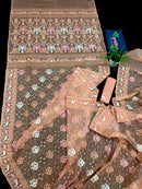 Creamy peach jamdani saree with pink white and peach threads work.