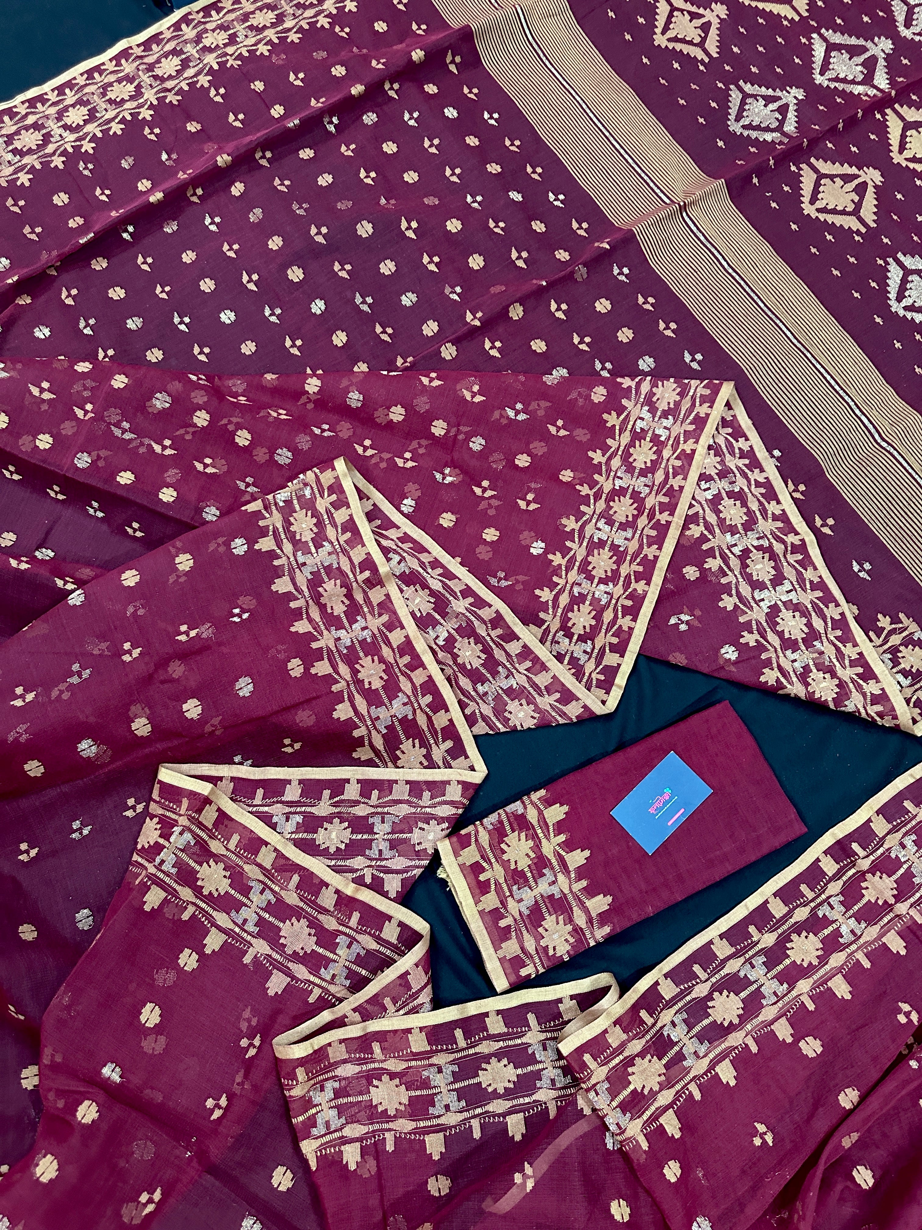 Maroon cotton jamdani with yellowish threads work.