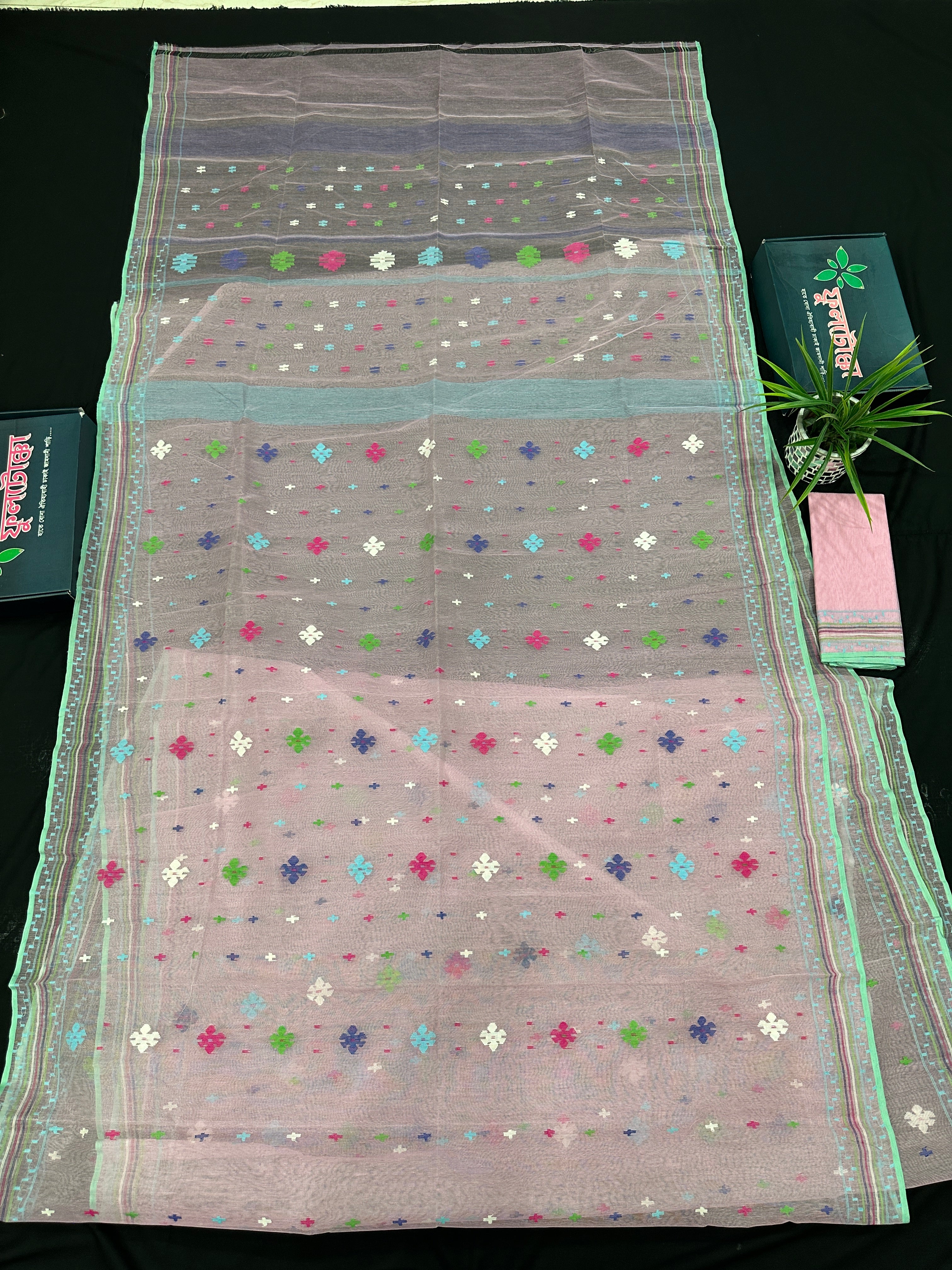 Baby pink jamdani saree with blue pink green threats work and blouse piece.