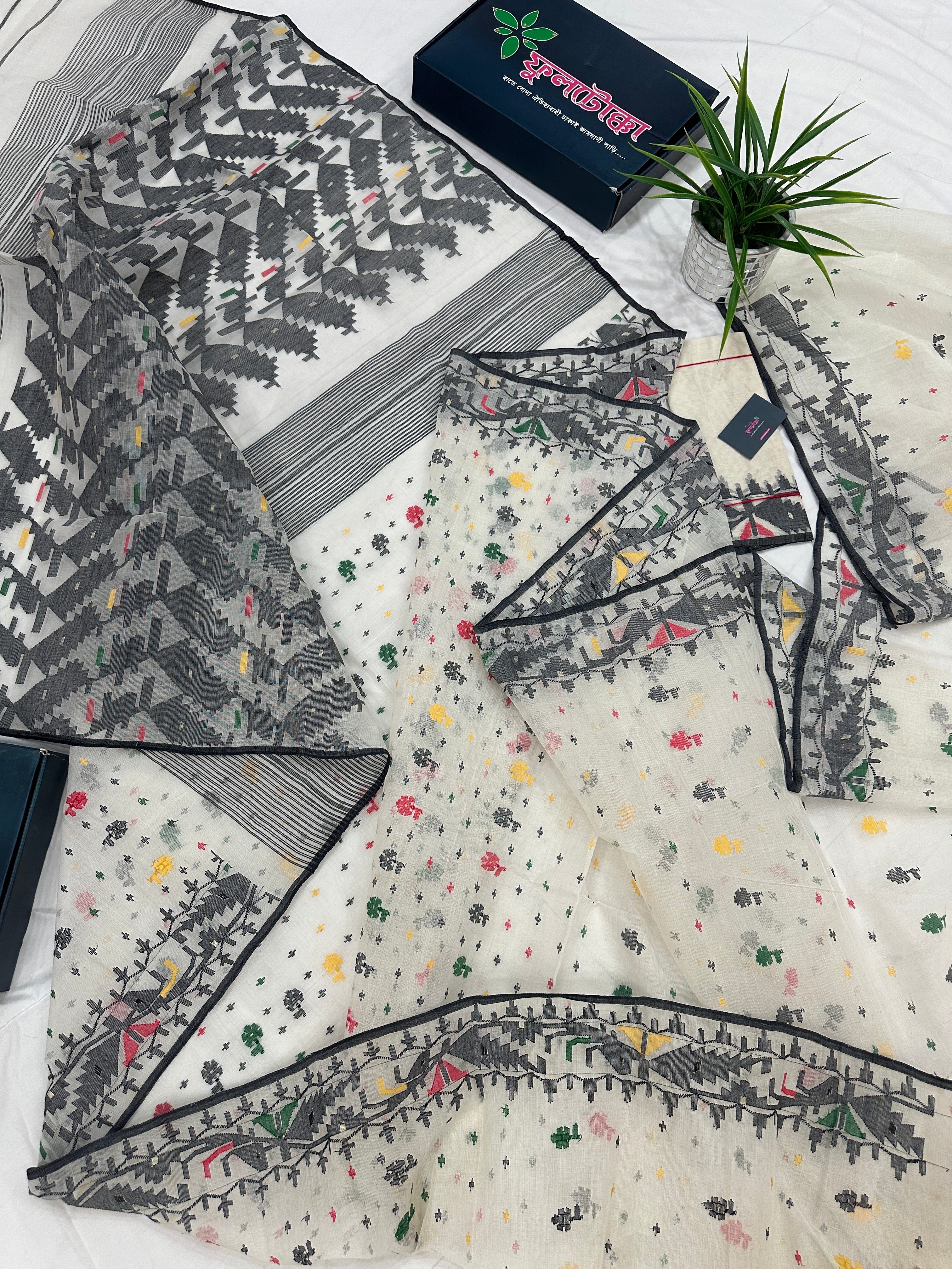 White cotton jamdani saree with black red yellow green threads work & blouse piece.