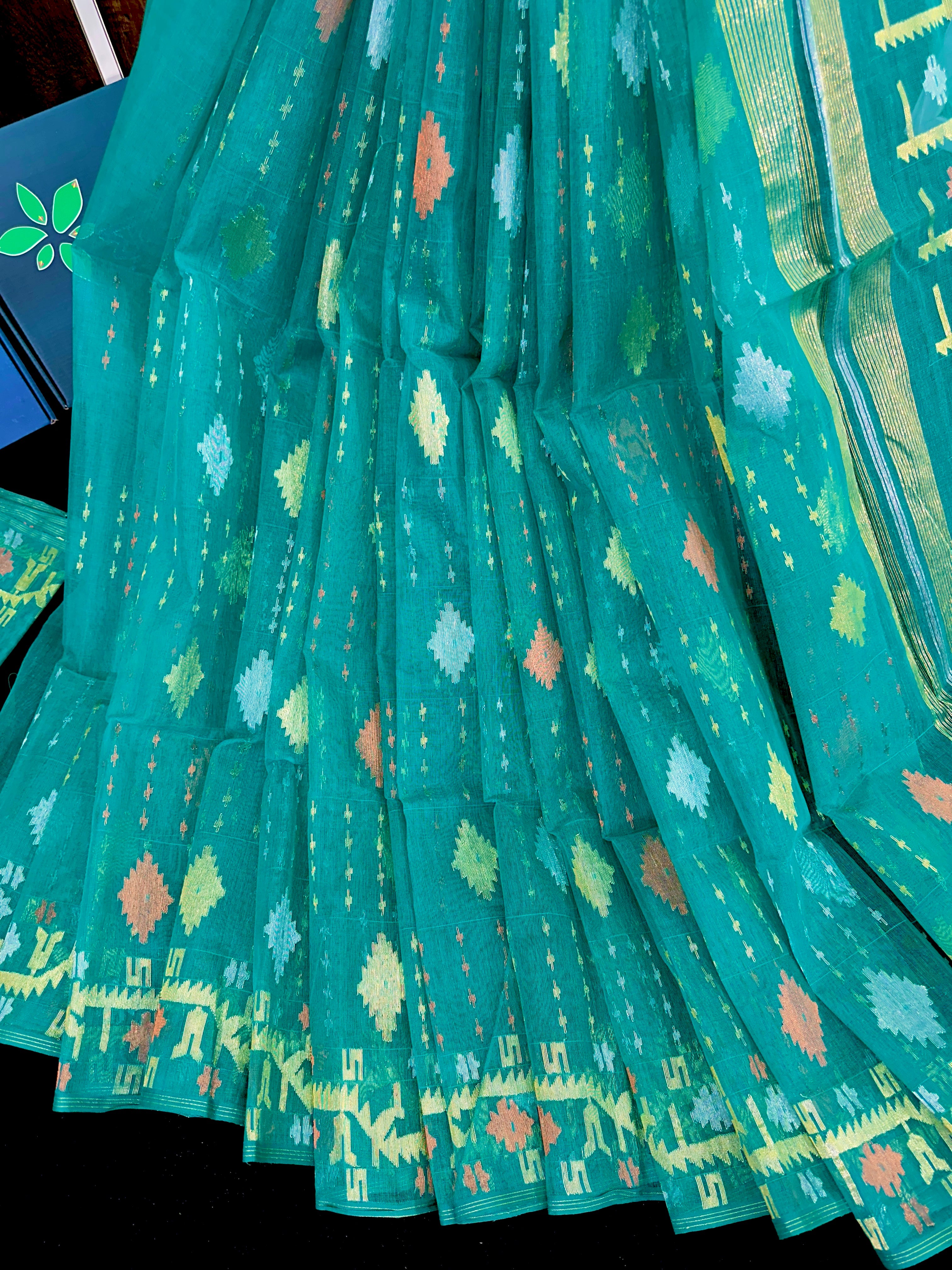 Sea green halfsilk jamdani saree with golden silver & copper jori work.