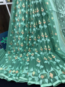 Jade green halfsilk jamdani saree with green off white golden self threads work
