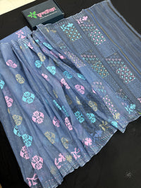 Powdery blue jamdani saree with pink blue and golden jori work.