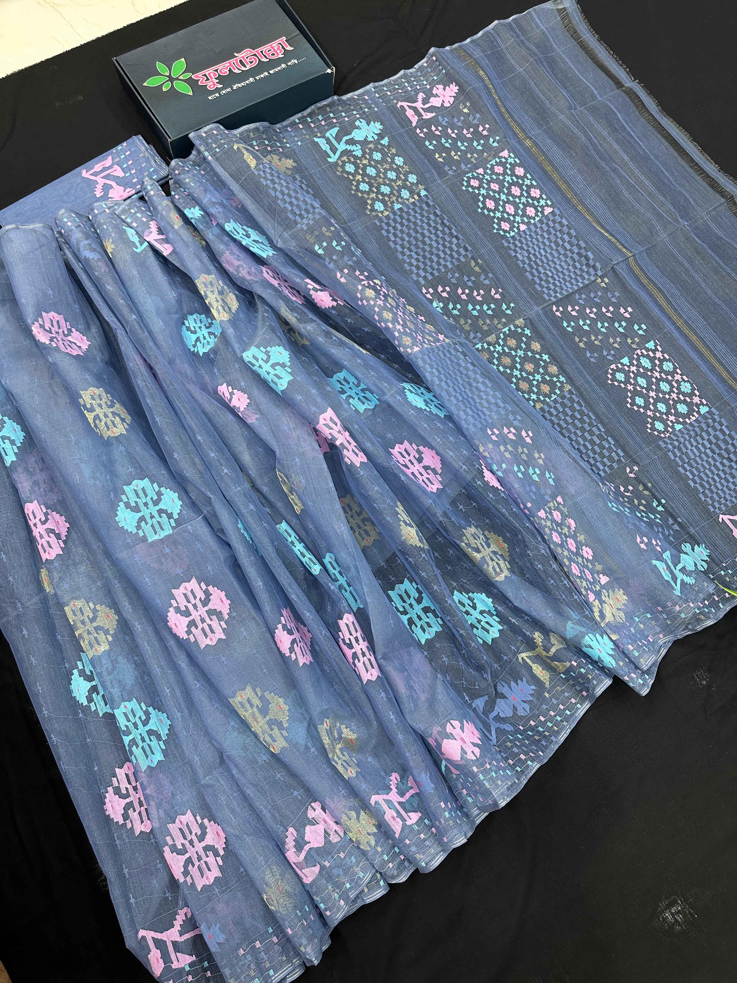 Powdery blue jamdani saree with pink blue and golden jori work.