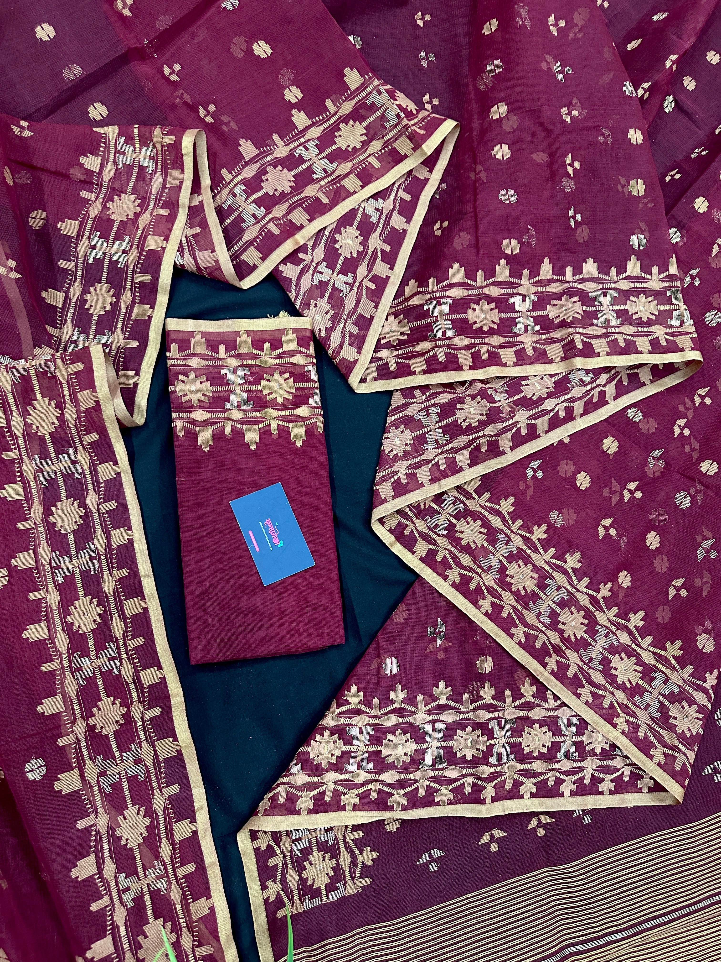 Maroon cotton jamdani with yellowish threads work.