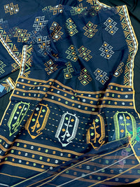 Navy blue jamdani saree with orange  green & off white threads work.