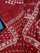 Maroon jamdani saree with white thread work.