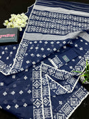 Deep blue jandani saree with white threads all over work.