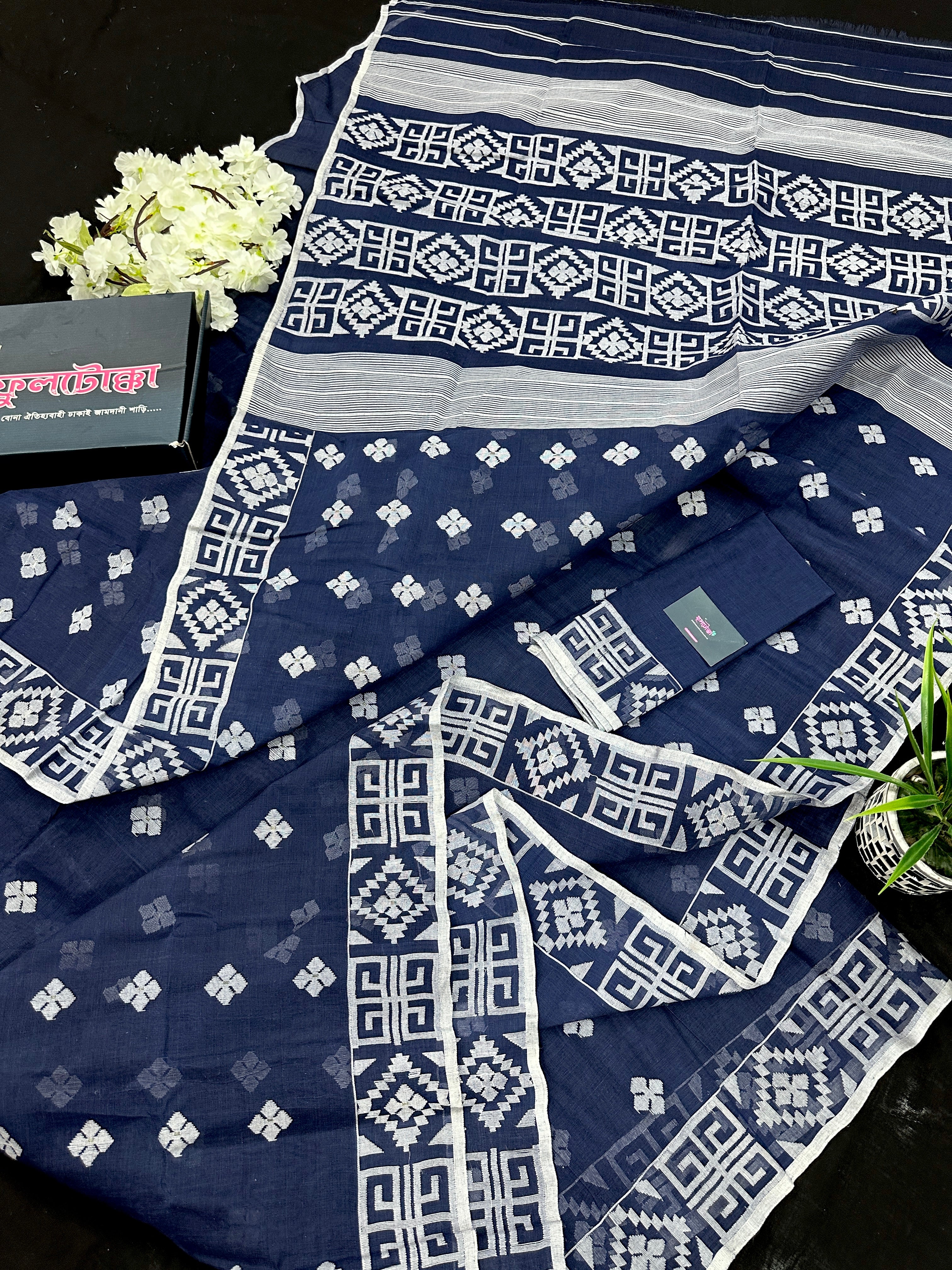 Deep blue jandani saree with white threads all over work.
