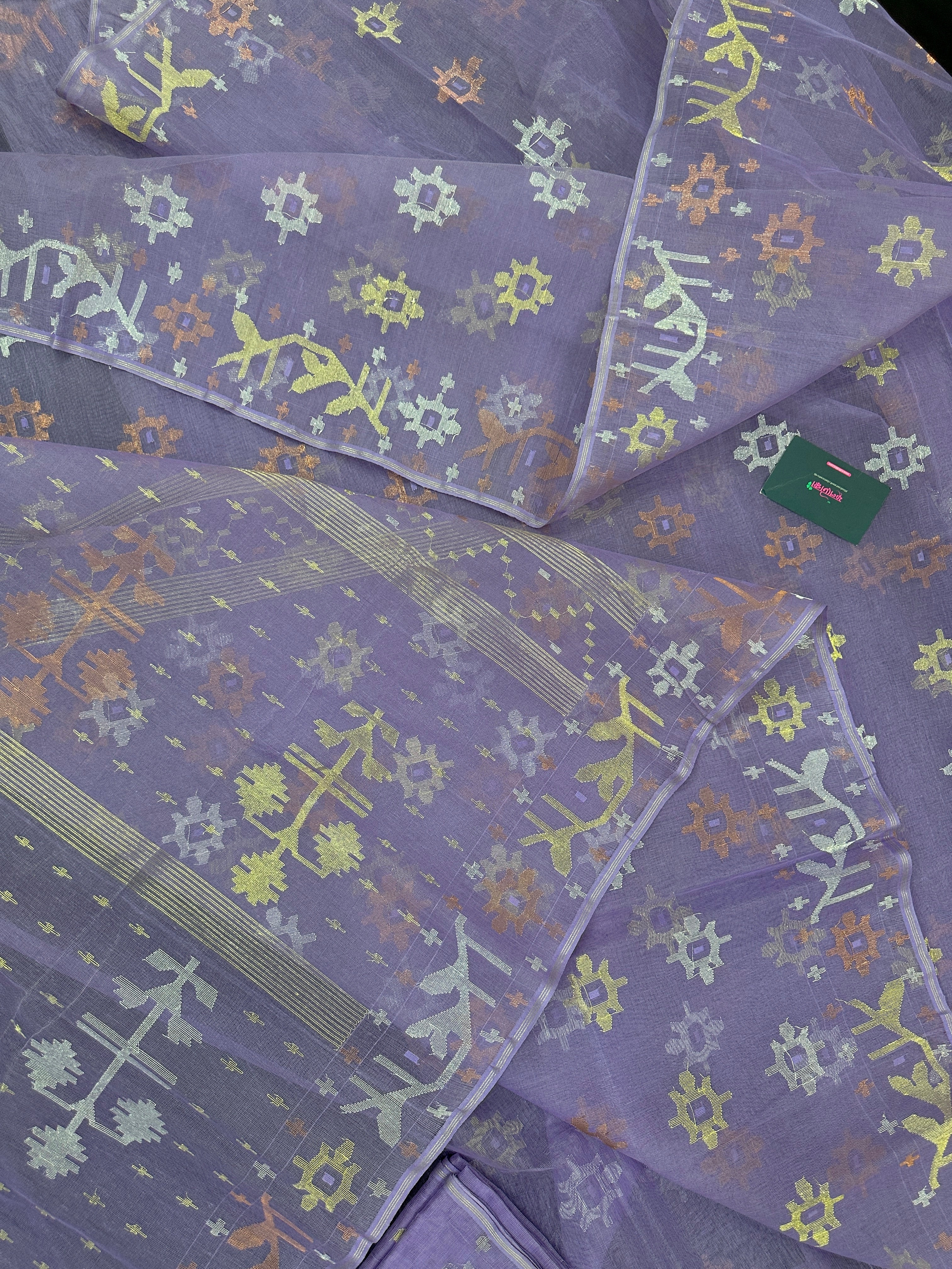 Lite lavender jamdani saree with golden silver copper jori work.