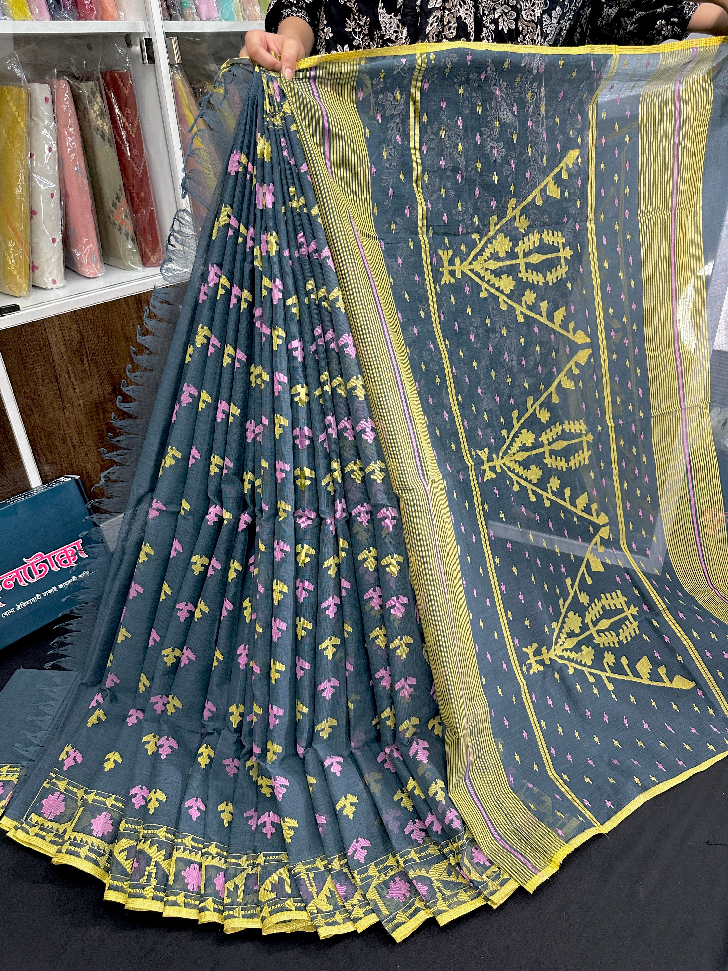Ash blue cotton jamdani saree with yellow pink threads work