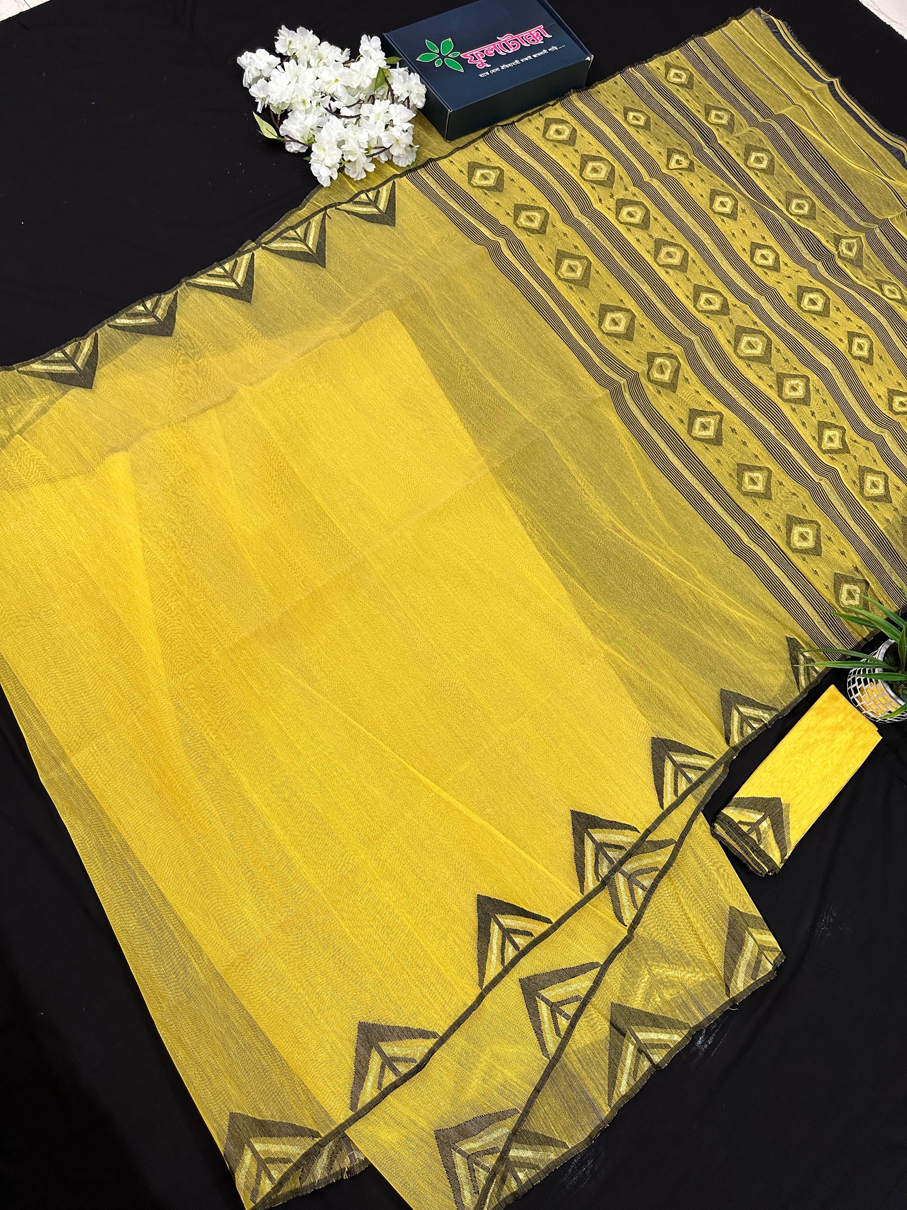 Yellow cotton jamdani sari with simple paar.