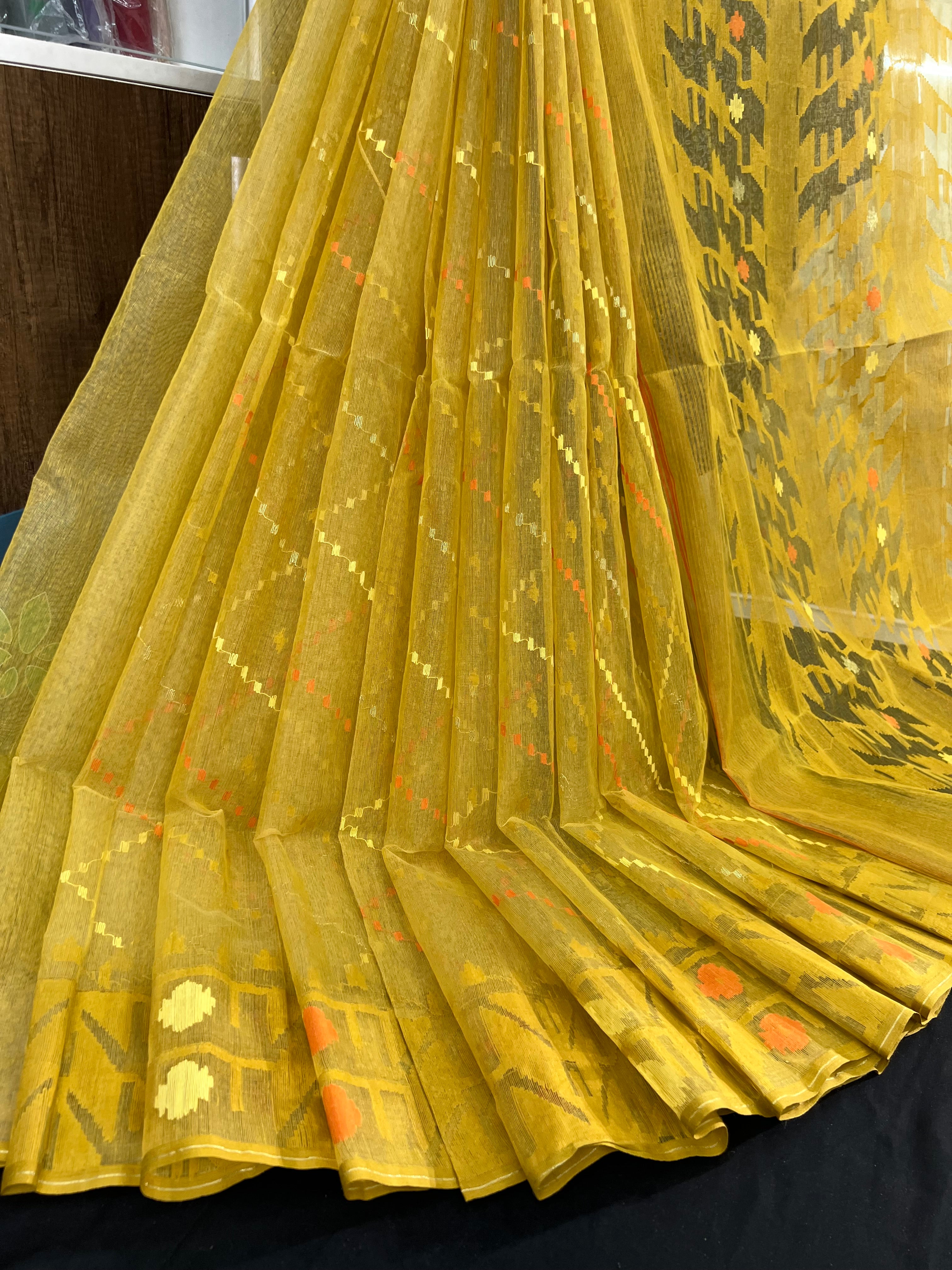 Yellow halfsilk jamdani saree with yellow orange threads work