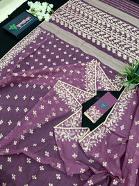 Onion cotton jamdani saree with yellowish threads work all over work.