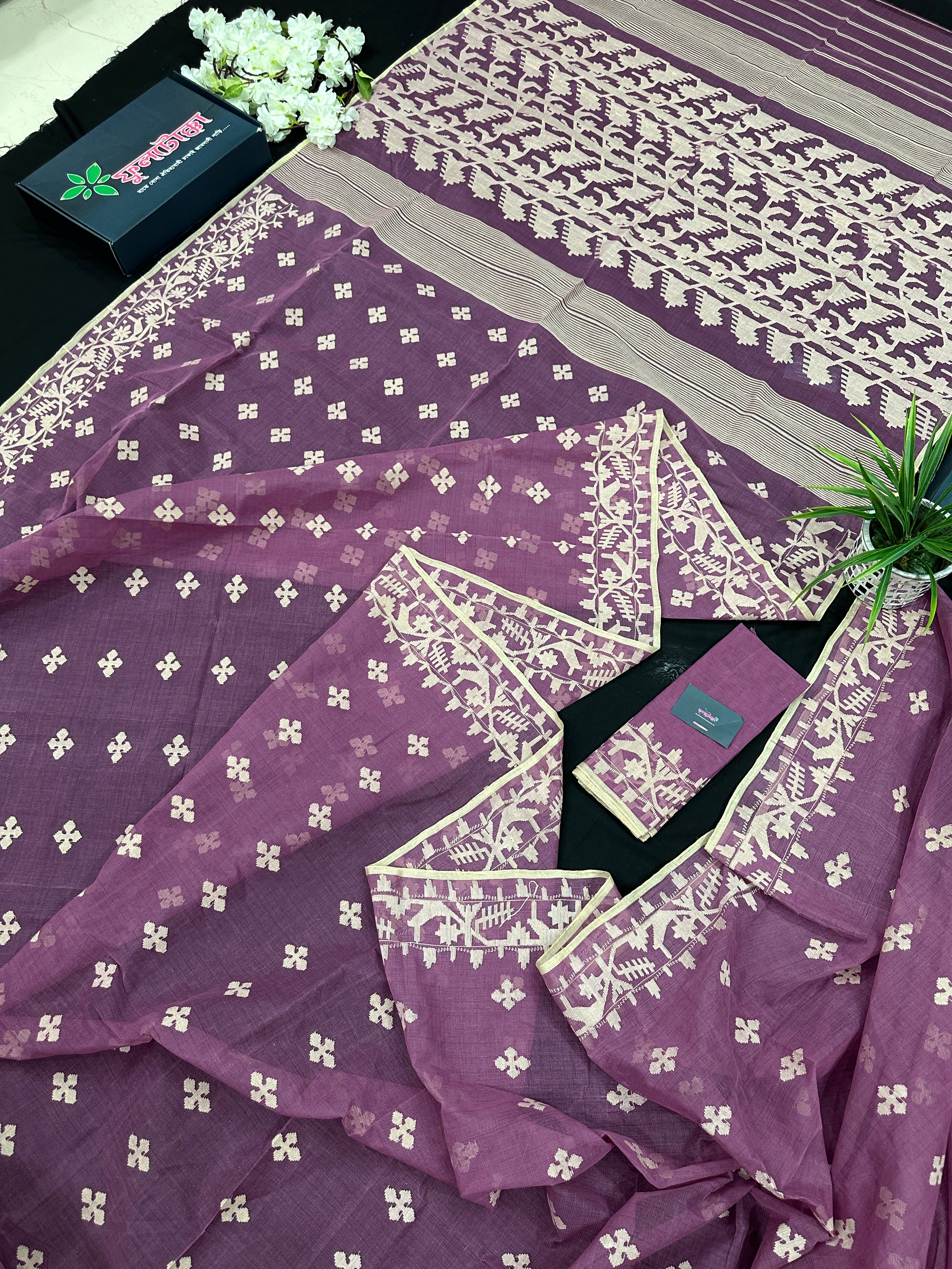 Onion cotton jamdani saree with yellowish threads work all over work.