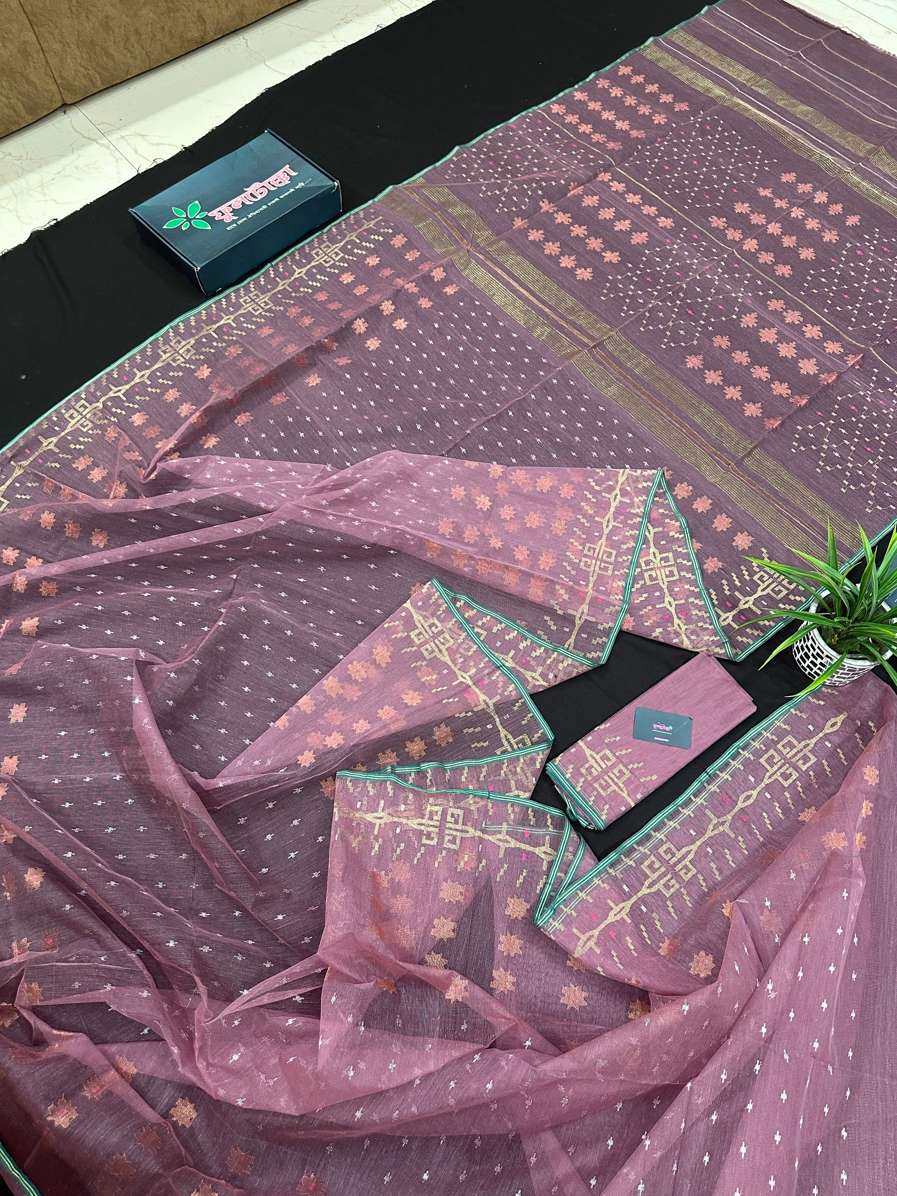 Onion colour jamdani saree with pink meena and green border.